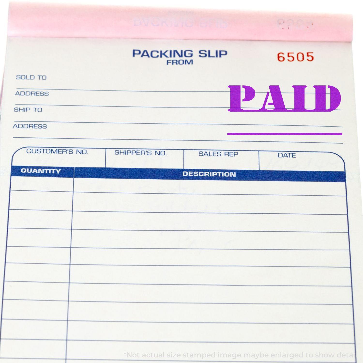 Packing slip with a Paid with Date Line Rubber Stamp in purple ink, showing the word PAID prominently stamped on it.