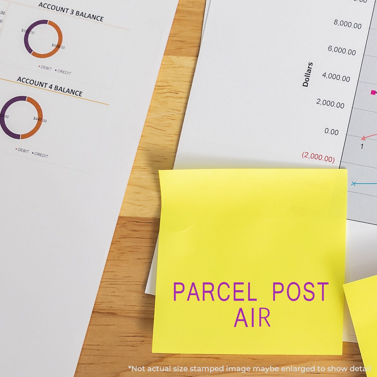 Self Inking Parcel Post Air Stamp on a yellow sticky note, placed on a desk with financial charts and documents in the background.