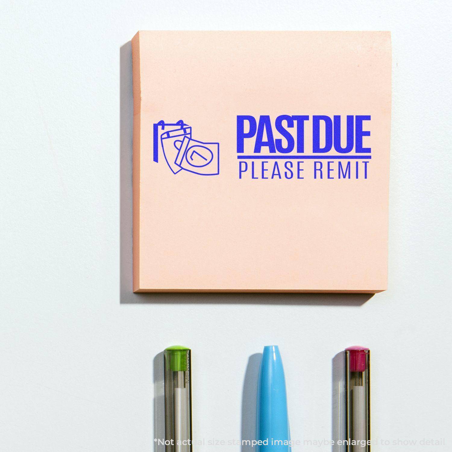 Large Past Due Please Remit with Calendar Rubber Stamp on a pink notepad, with three pens below.