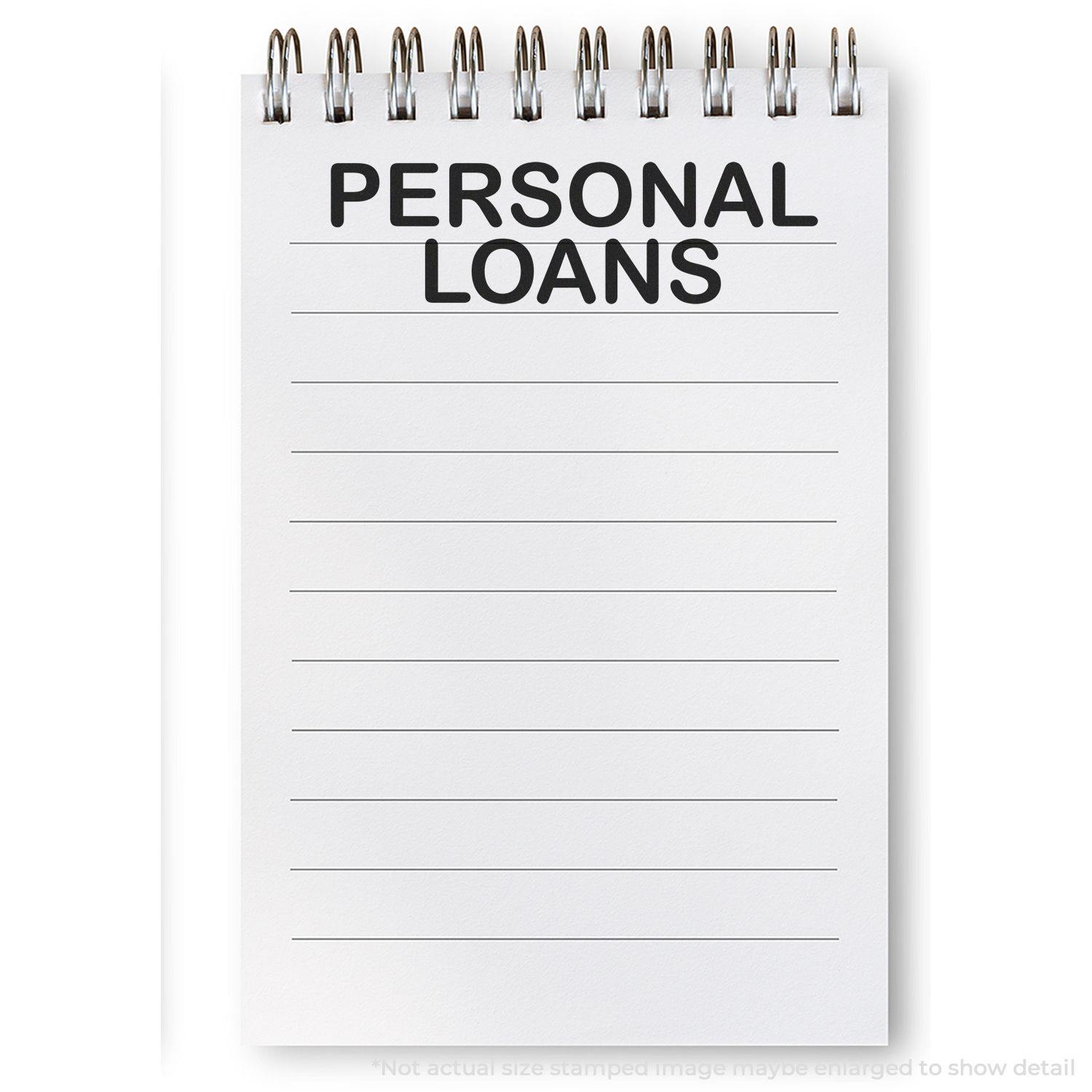 A notepad with PERSONAL LOANS stamped on it using the Large Personal Loans Rubber Stamp. The notepad has lined pages and a spiral binding.