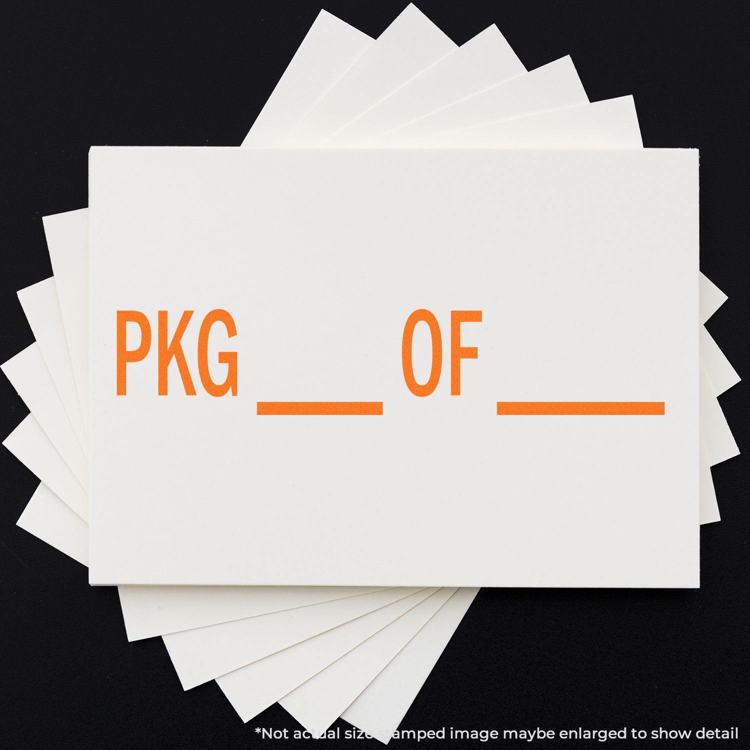 White cards with orange text 'PKG OF' stamped using Slim Pre-Inked Pkg Of Stamp, arranged in a fan shape on a black background.