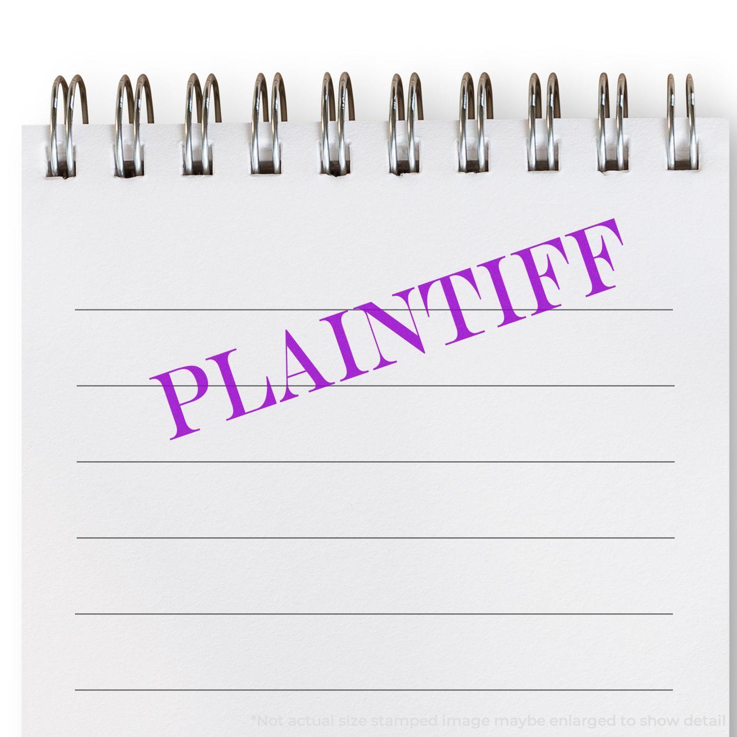 Large Plaintiff Rubber Stamp in purple ink on a spiral-bound notepad with lined paper.