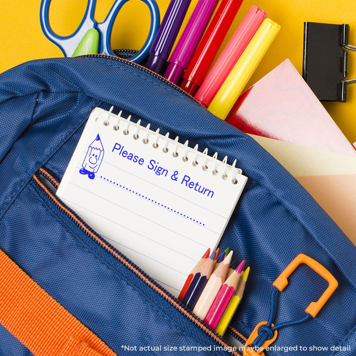 Large Self Inking Please Sign and Return Stamp used on a notepad placed in a blue backpack with colorful stationery items.