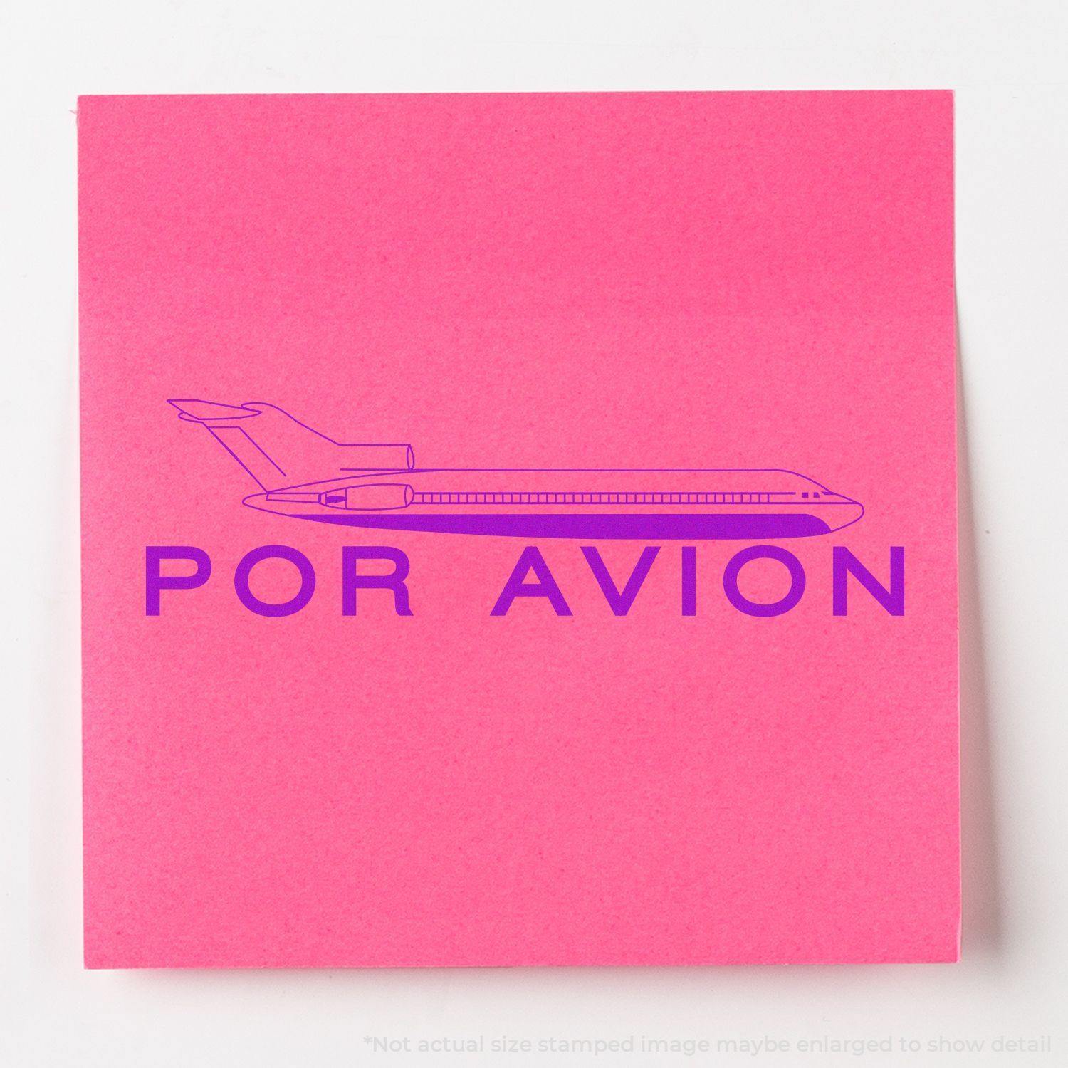 A stock office rubber stamp with a stamped image showing how the text "POR AVION" in a large bold font with an airplane icon above the text is displayed after stamping.