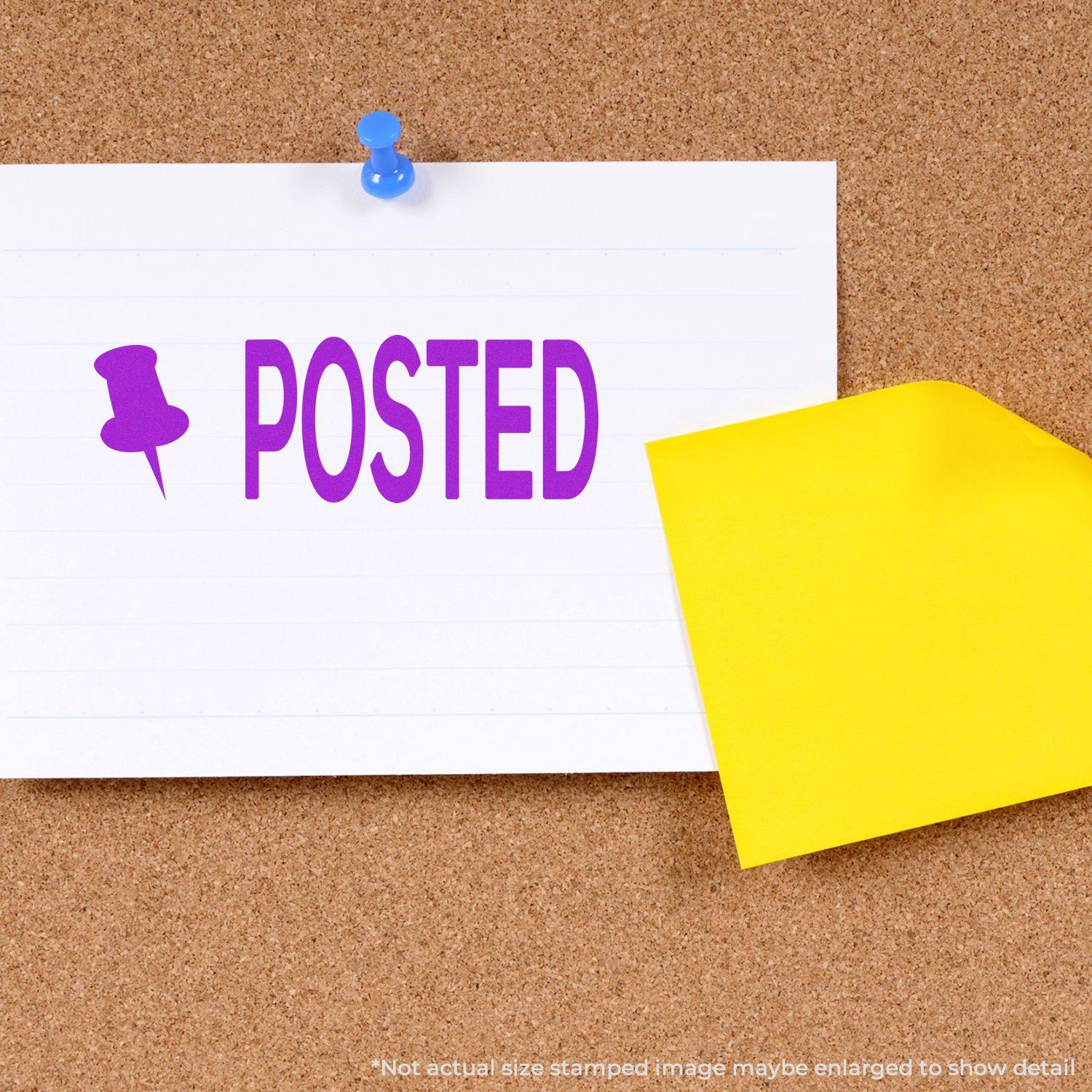 Large Self Inking Posted with Thumbtack Stamp in purple ink on a white card pinned to a corkboard with a blue thumbtack, yellow paper beside it.