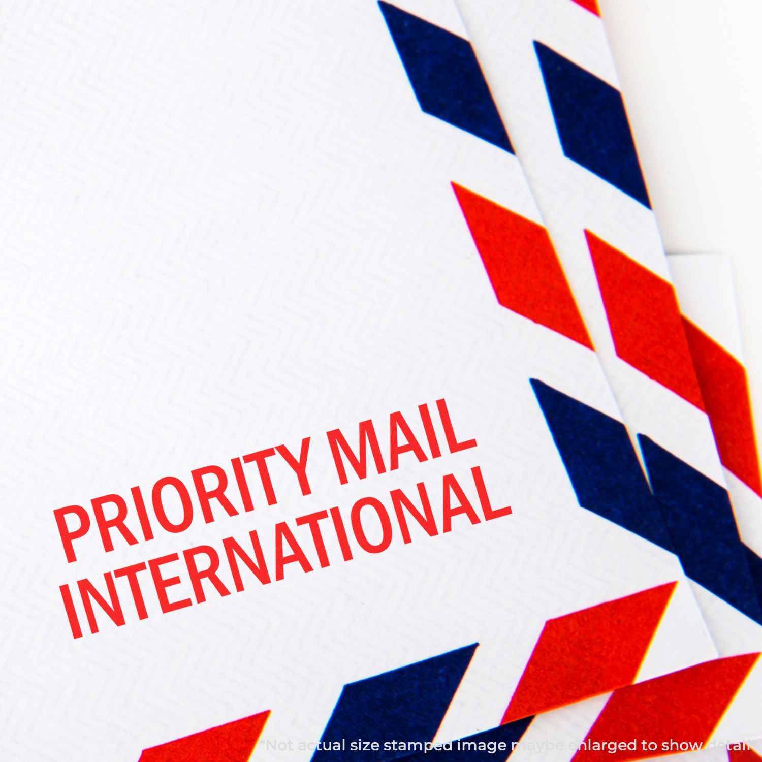 Self Inking Priority Mail International Stamp on white envelope with red and blue chevron border.