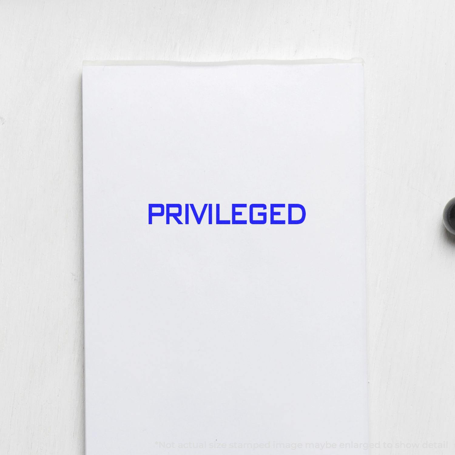 Large Privileged Rubber Stamp in blue ink on white paper, showing the word PRIVILEGED clearly stamped in the center.