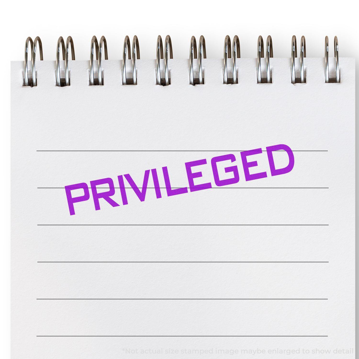 Slim Pre-Inked Privileged Stamp in purple ink on a white notepad with spiral binding, displaying the word PRIVILEGED .