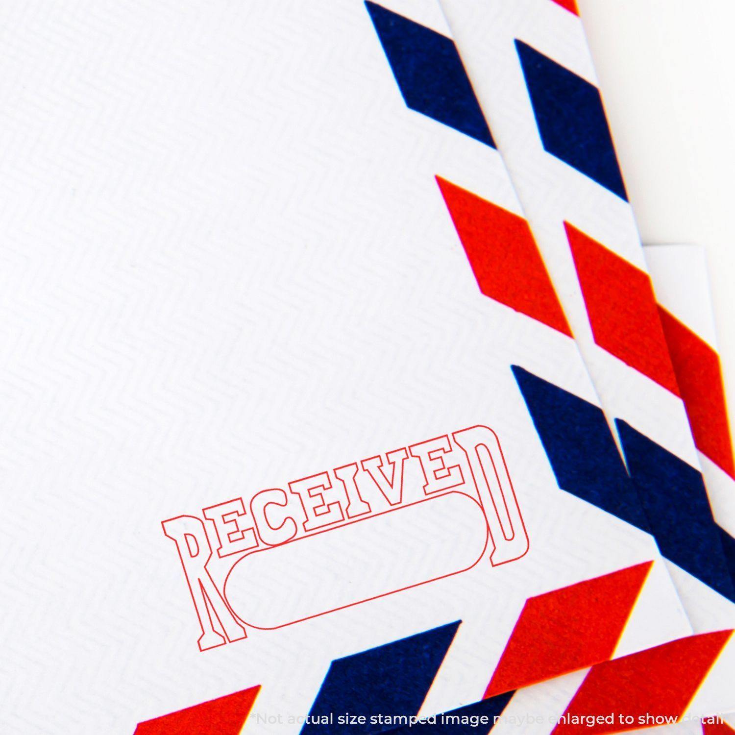 Envelope stamped with RECEIVED using the Large Received with Date Box Rubber Stamp, featuring red and blue diagonal stripes on the border.