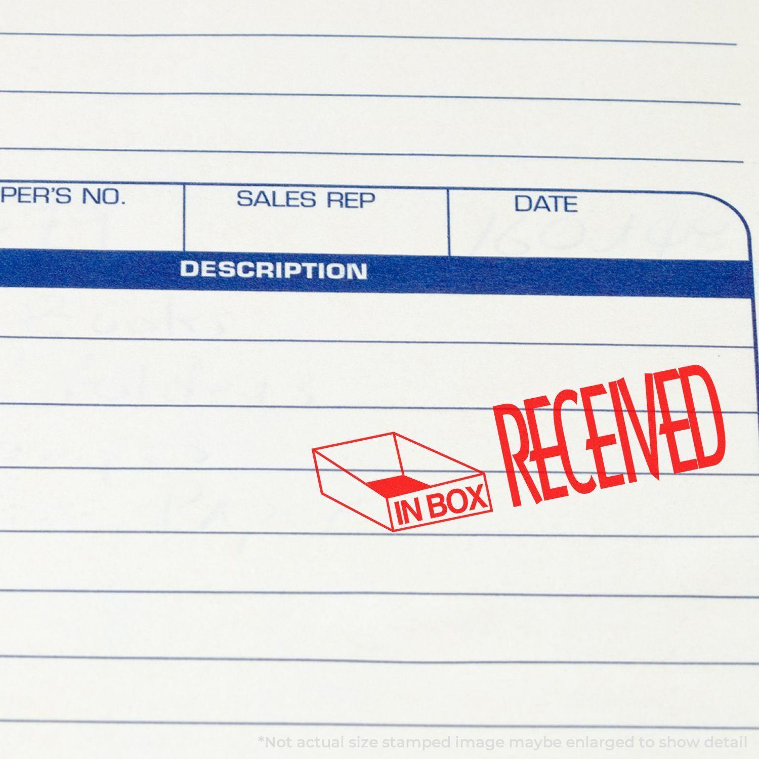 Large Pre-Inked Received with In Box Icon Stamp in red ink on a document with description, sales rep, and date fields.