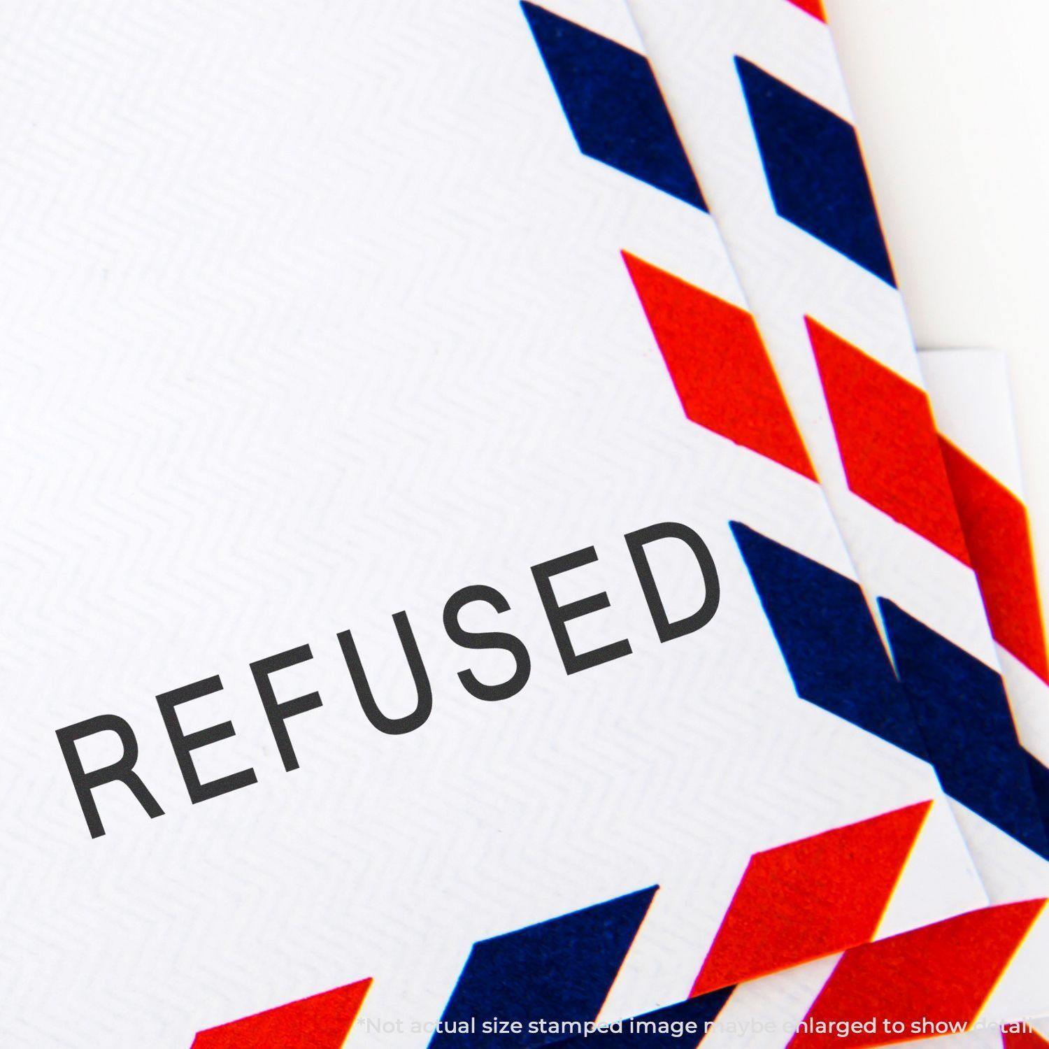 Envelope stamped with REFUSED using the Large Refused Rubber Stamp, showing bold black text on a white background with red and blue accents.