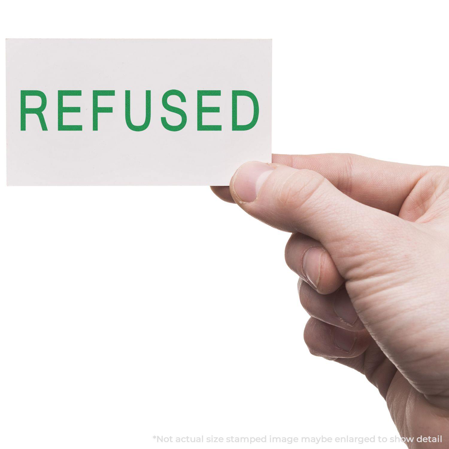 A hand holding a card stamped with REFUSED in green ink using the Large Pre-Inked Refused Stamp.