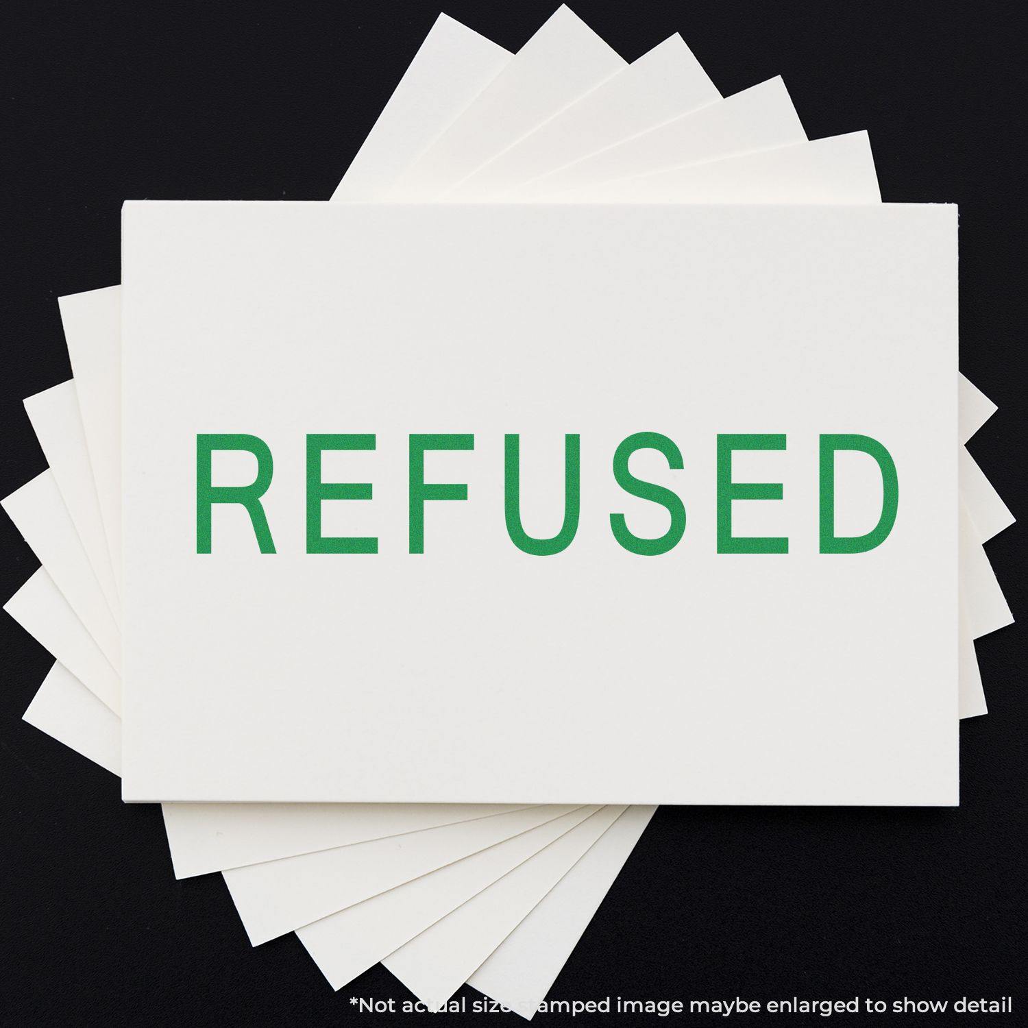 Large Pre-Inked Refused Stamp in green ink on white paper, displayed on a black background.