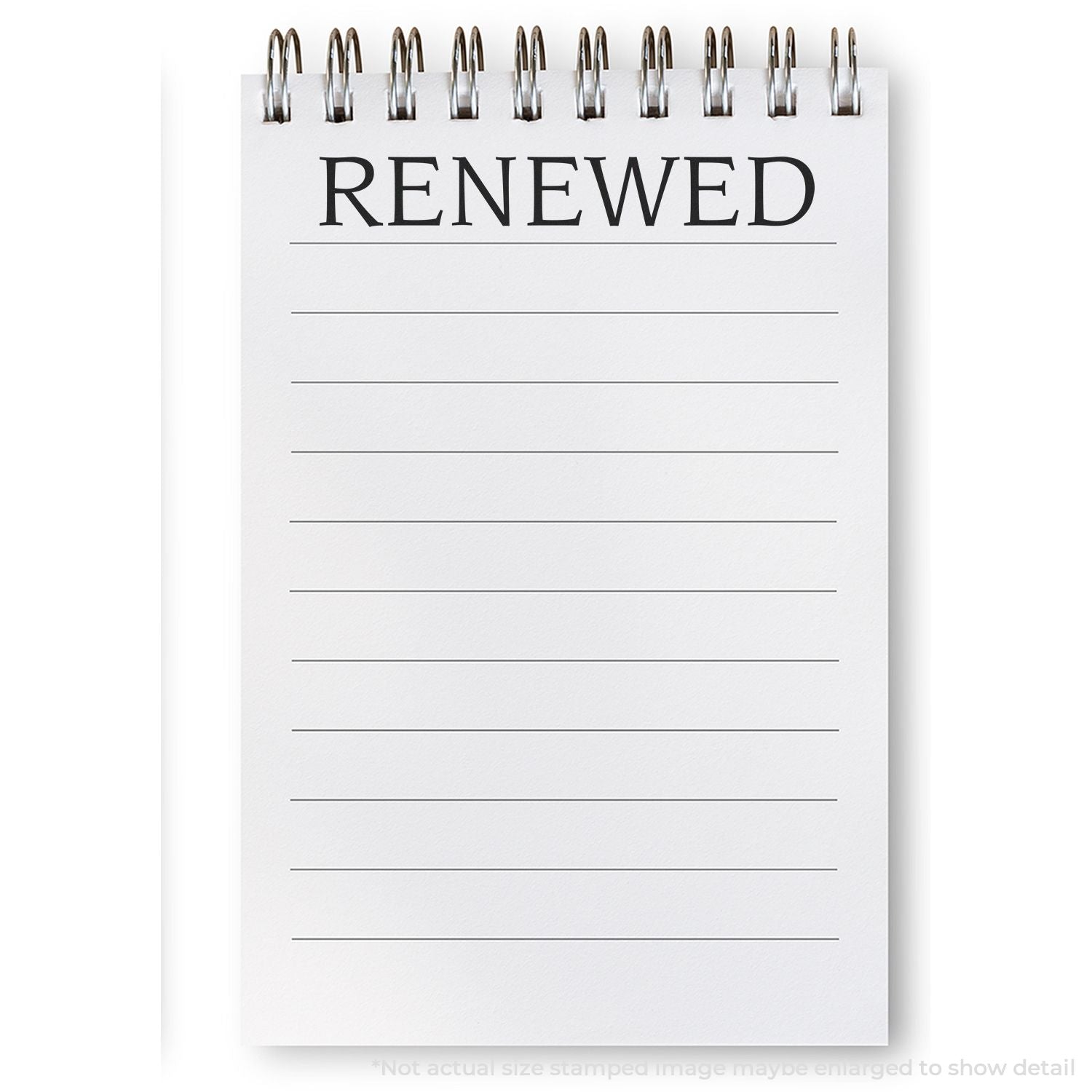 Self Inking Renewed Stamp imprint on a spiral notepad with lined paper. The word RENEWED is stamped at the top of the page.