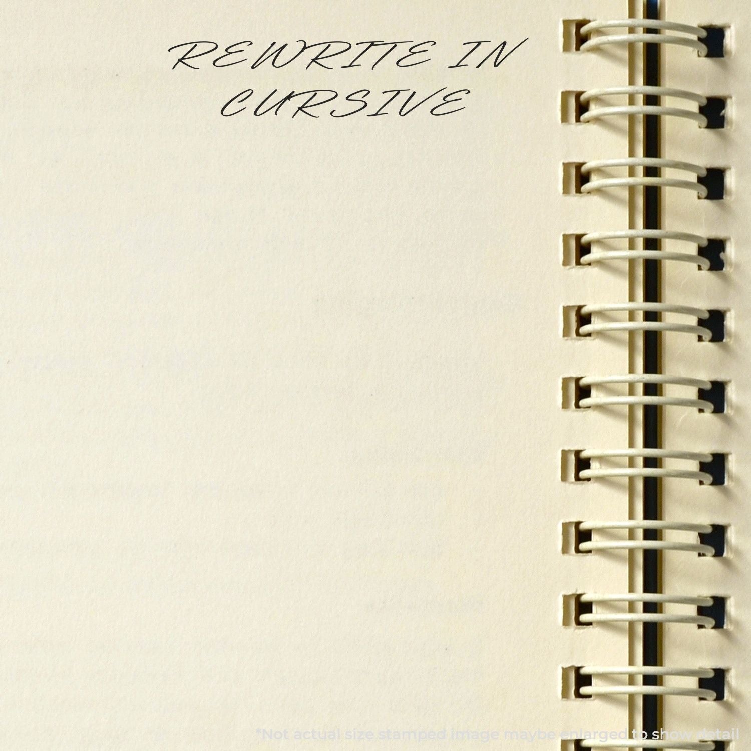 Self Inking Rewrite In Cursive Stamp used on a spiral-bound notebook, showing the text 'REWRITE IN CURSIVE' in elegant handwriting.