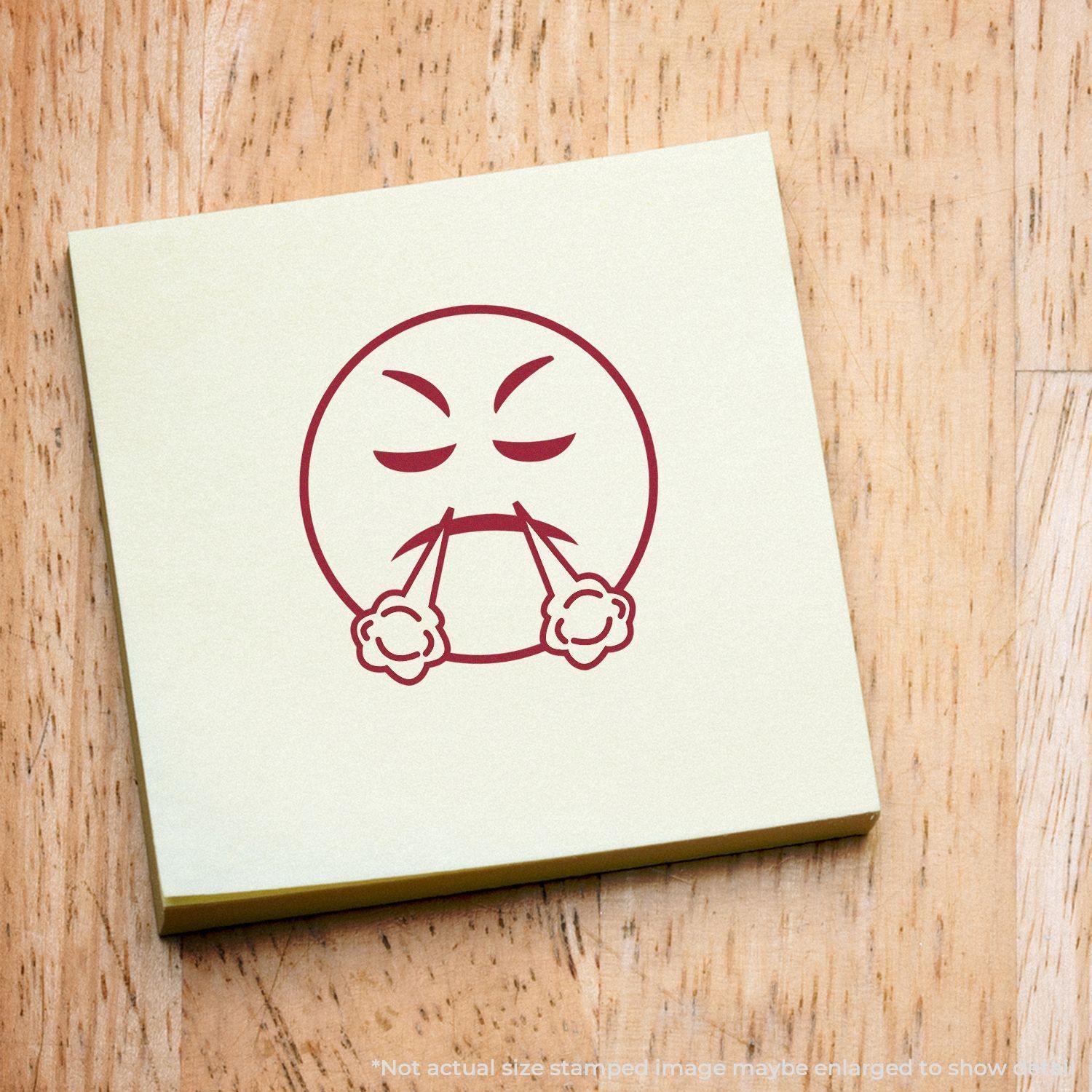 Round Angry Smiley Rubber Stamp impression on a yellow sticky note, showing an angry face with steam coming out of its nostrils.