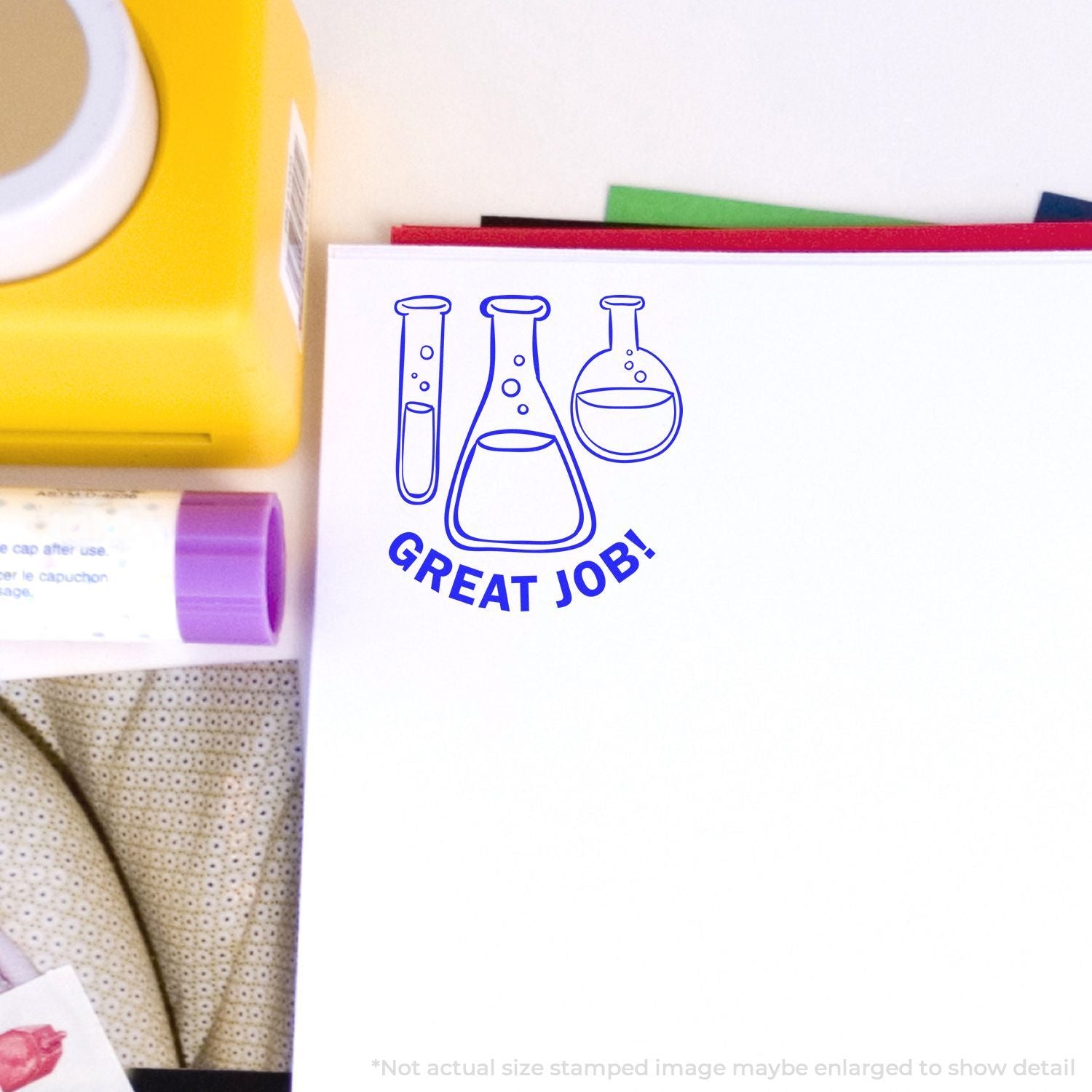 Self Inking Round Chemistry Great Job Stamp in blue ink on white paper, surrounded by stationery items.