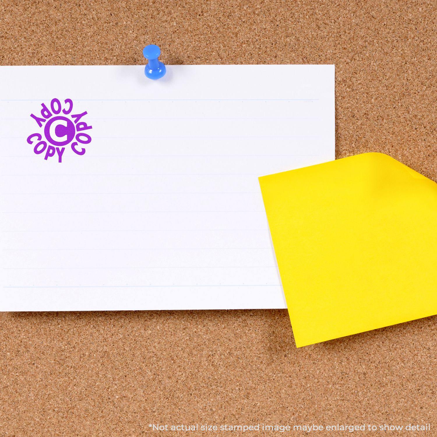 Round Copy Copy Copy Rubber Stamp on a white paper pinned to a corkboard with a yellow sticky note beside it.