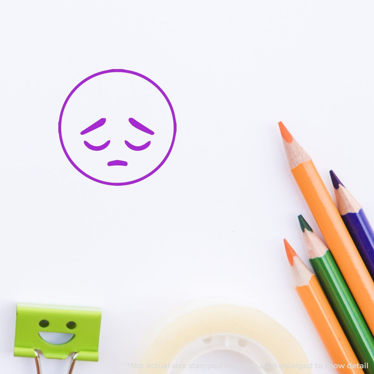 Self-Inking Round Sad Smiley Stamp In Use Photo