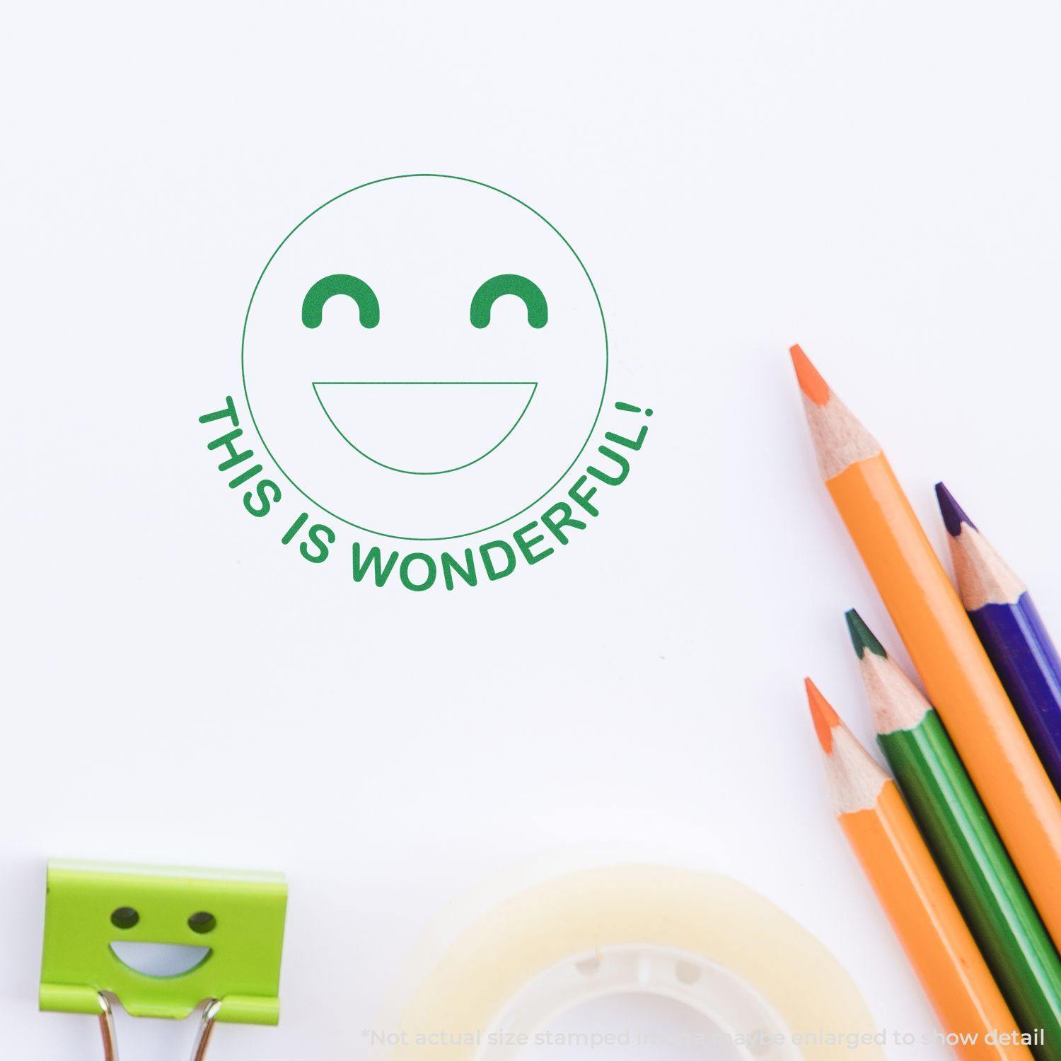 Round This is Wonderful smiley rubber stamp impression on white paper, surrounded by colorful pencils, tape, and a smiley clip.