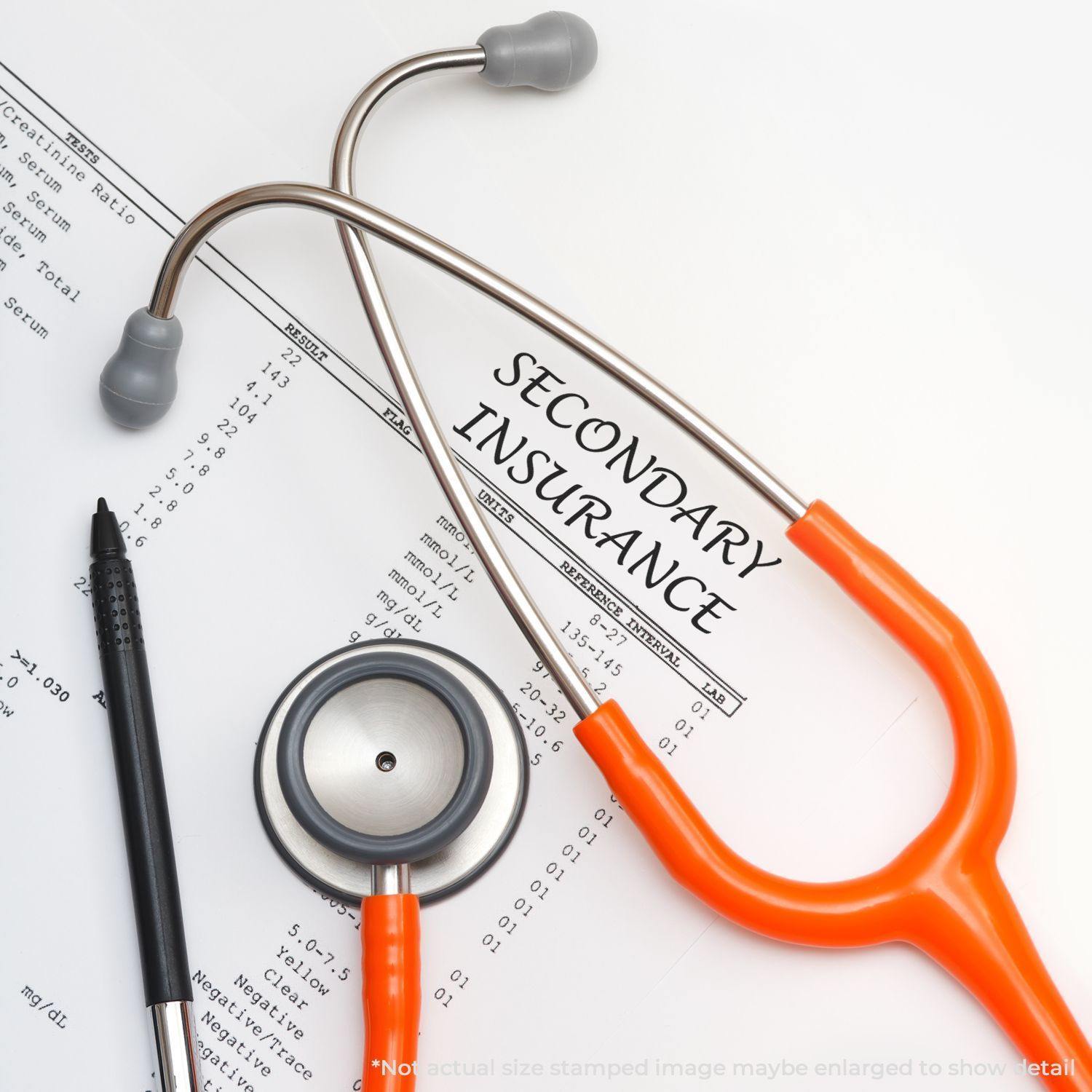 Large Secondary Insurance Rubber Stamp used on a document with a stethoscope and pen placed nearby.