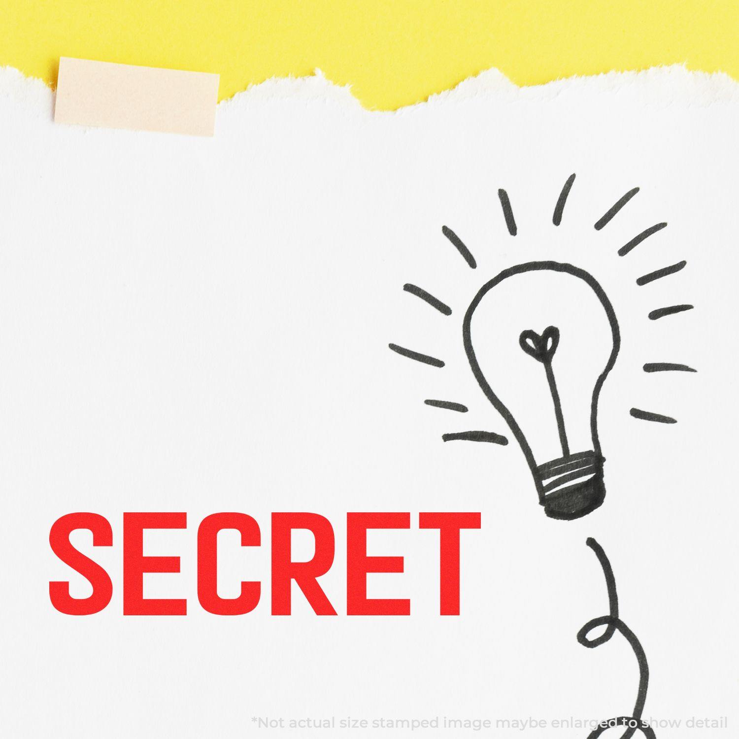 Large Secret Rubber Stamp imprint in red on white paper with a lightbulb doodle, against a yellow background.