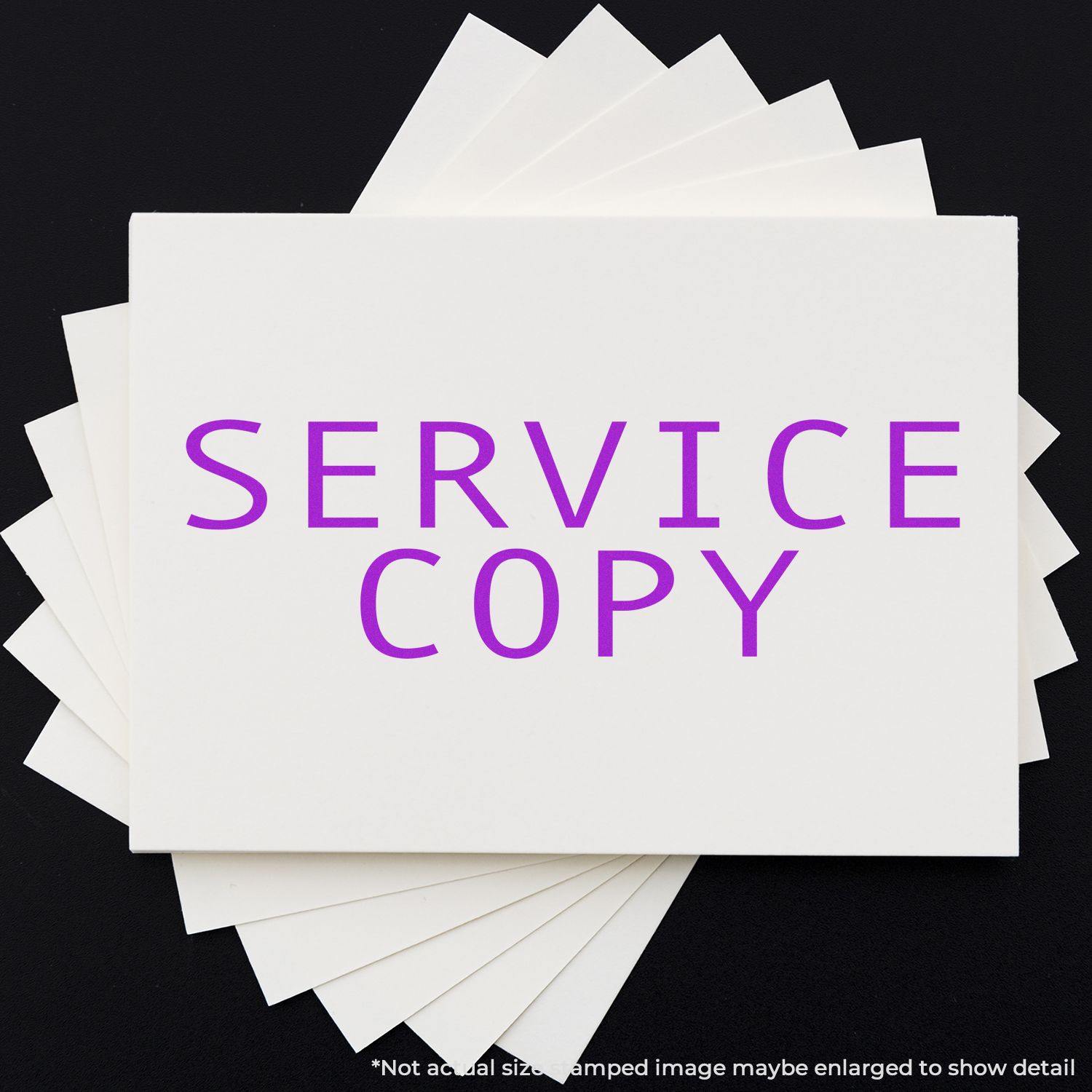 Large Self Inking Service Copy Stamp in purple ink on white paper, displayed on a black background with additional sheets underneath.