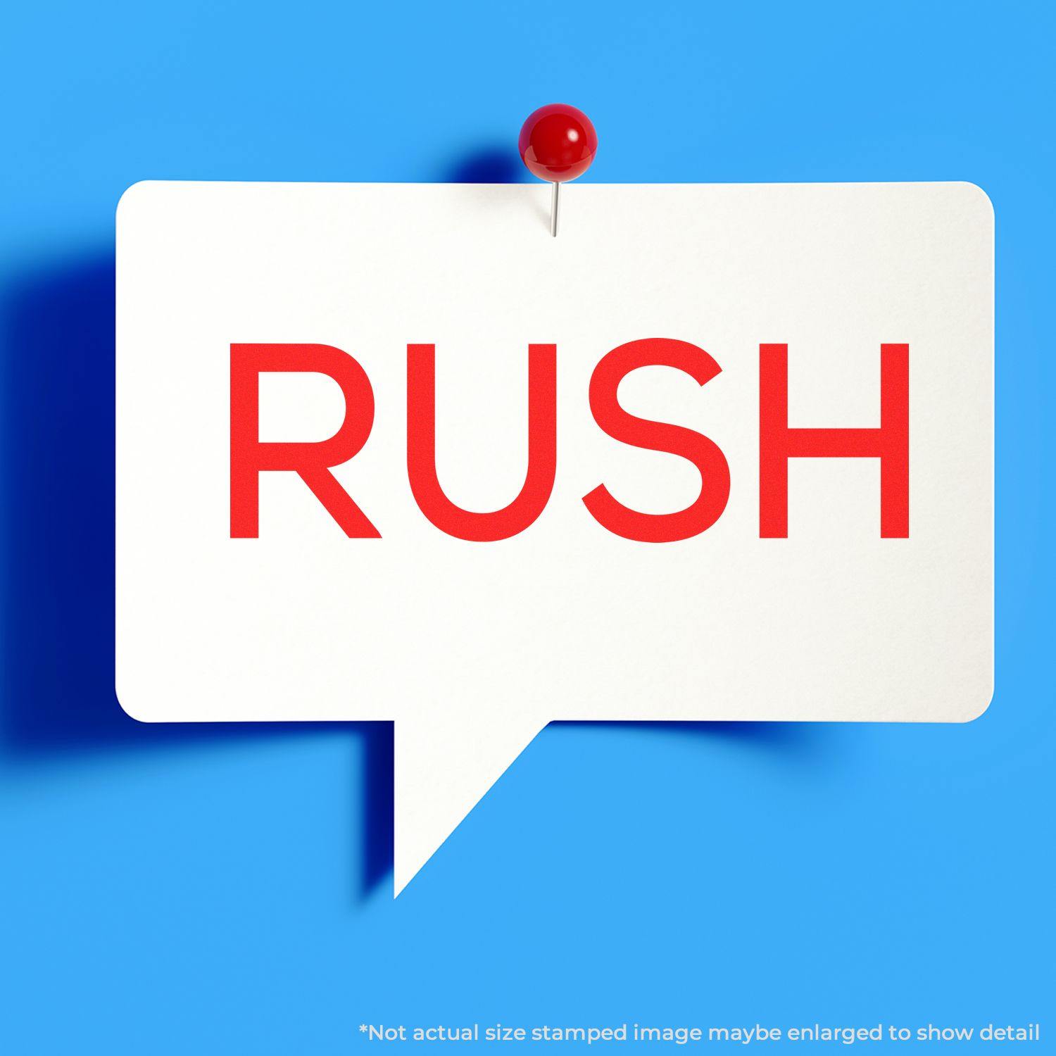 Large Pre-Inked Skinny Rush Stamp in use, displaying the word RUSH in bold red letters on a white speech bubble pinned to a blue background.