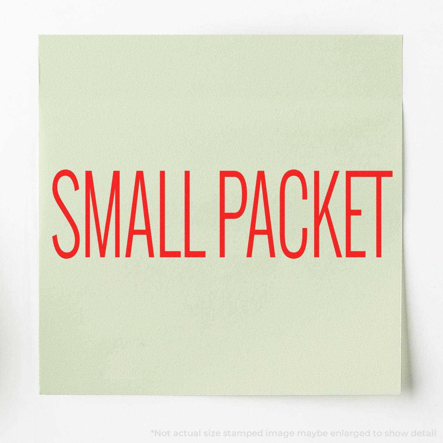 Slim Pre-Inked Small Packet Stamp used on a light green paper, displaying the text SMALL PACKET in bold red letters.