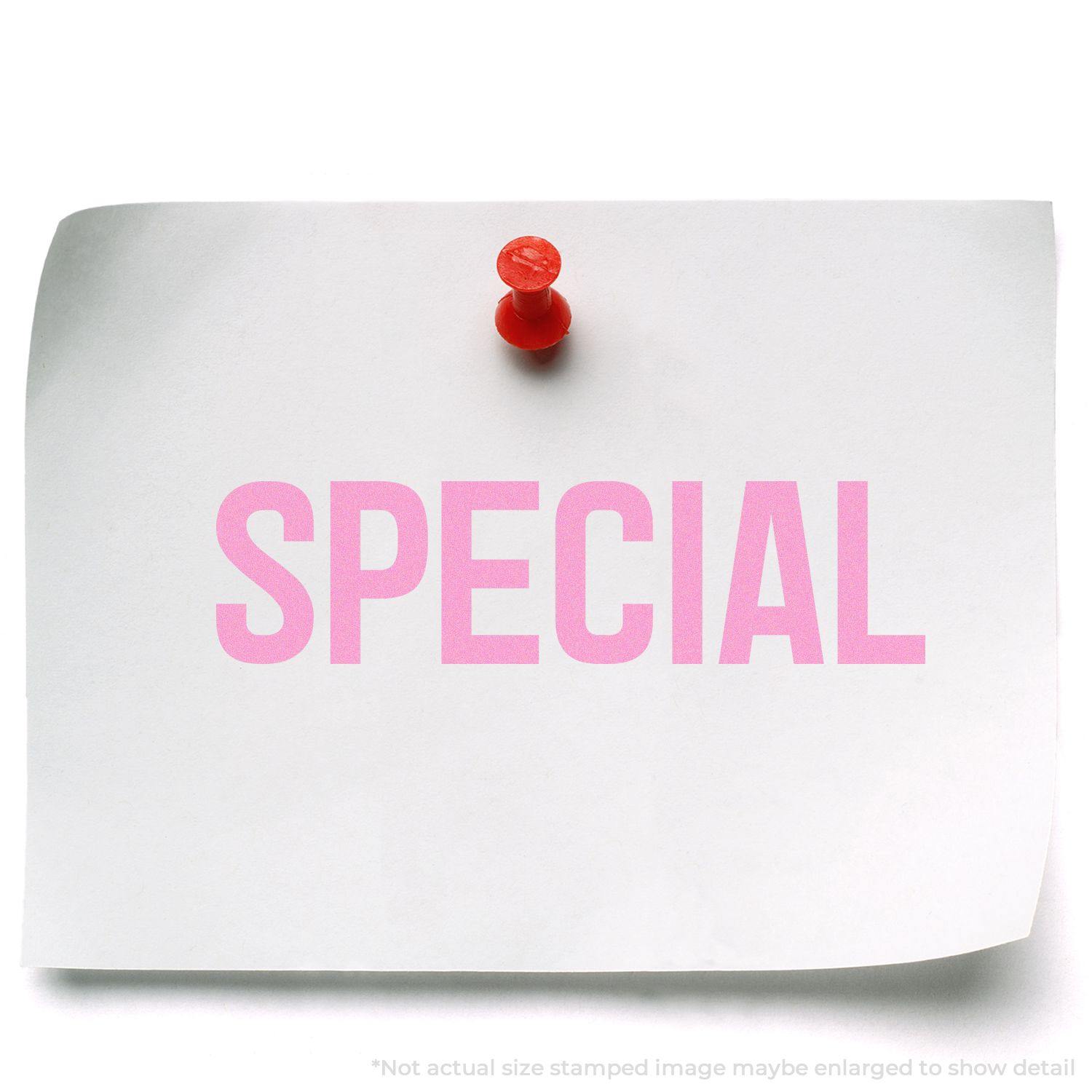 A large special rubber stamp imprint reading SPECIAL in pink on a white paper pinned with a red pushpin.