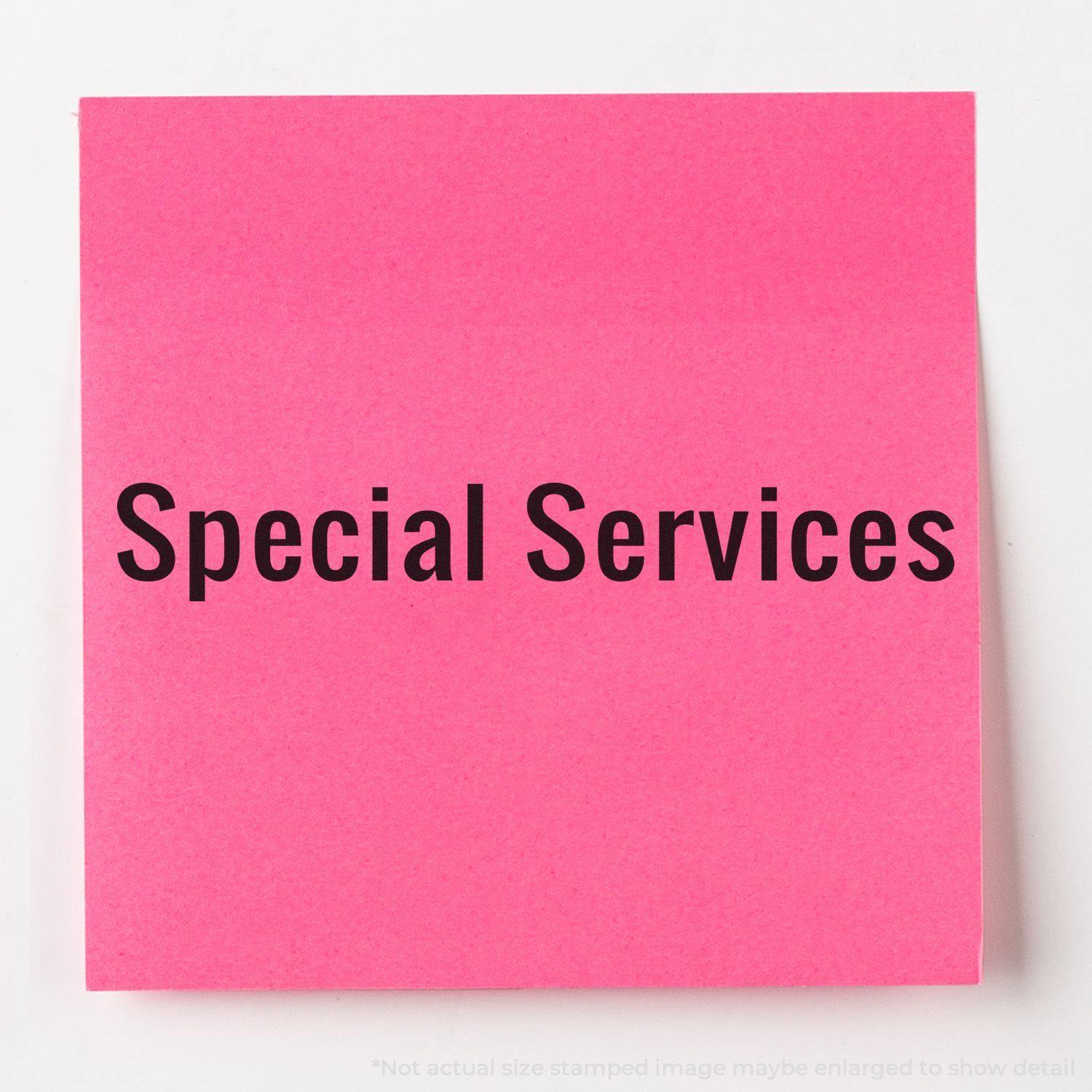 A stock office rubber stamp with a stamped image showing how the text "SPECIAL SERVICES" in a large font is displayed after stamping.