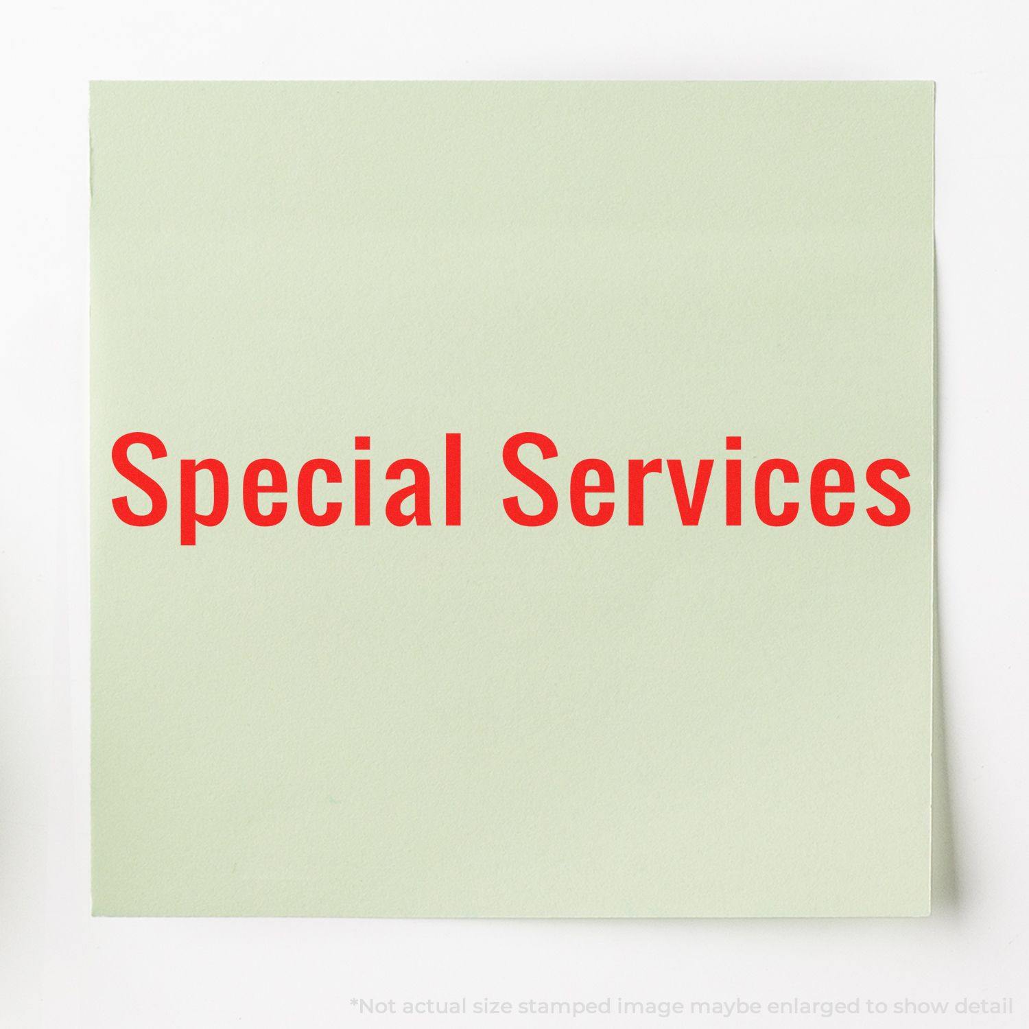 A green paper stamped with Special Services in red ink using the Self Inking Special Services Stamp.