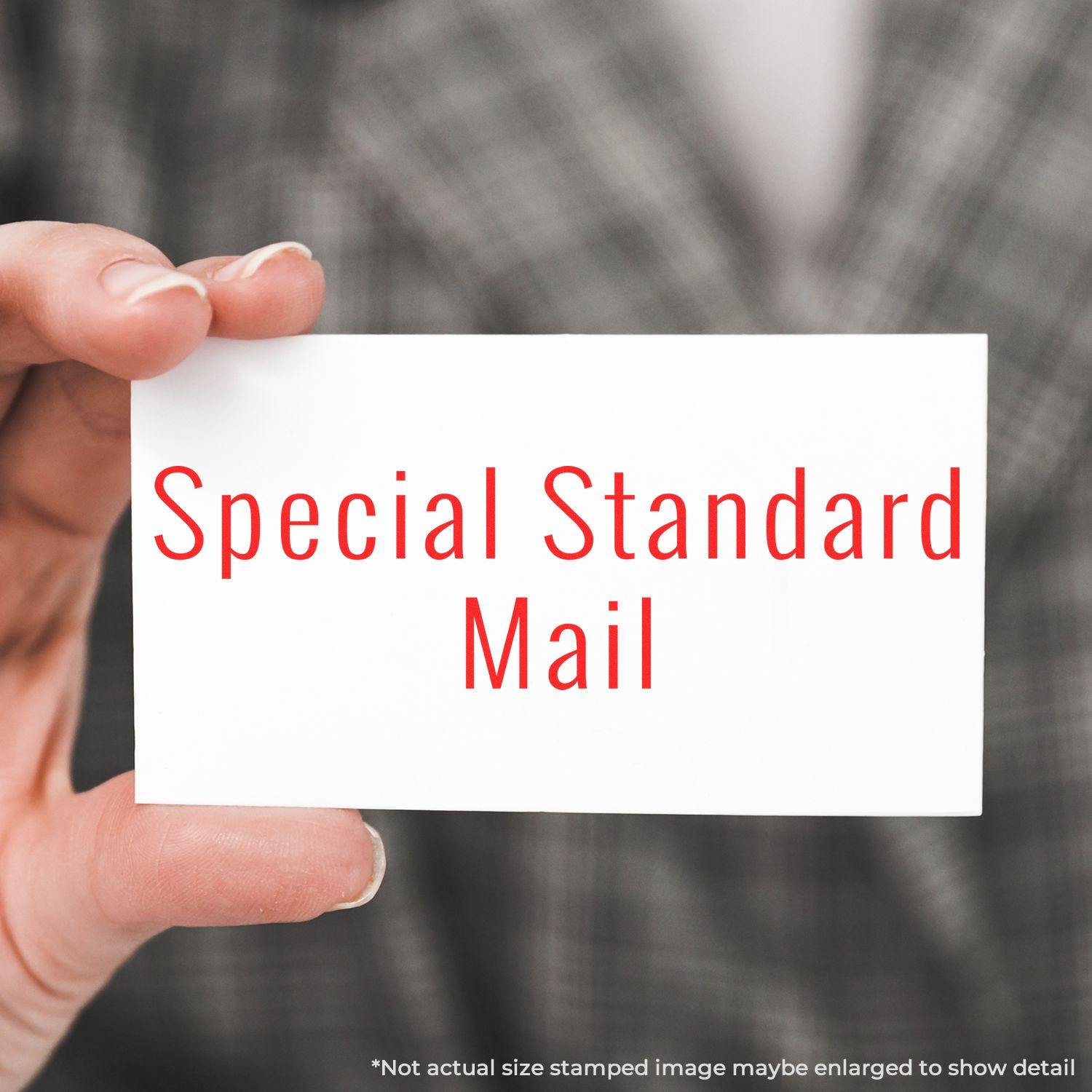 A self-inking stamp with a stamped image showing how the text "Special Standard Mail" in a large narrow font is displayed by it after stamping.