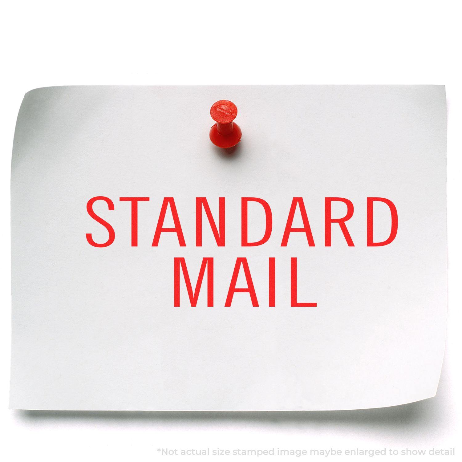 A white paper pinned to a board with a red pushpin, stamped with STANDARD MAIL in red using a Large Standard Mail Stacked Rubber Stamp.