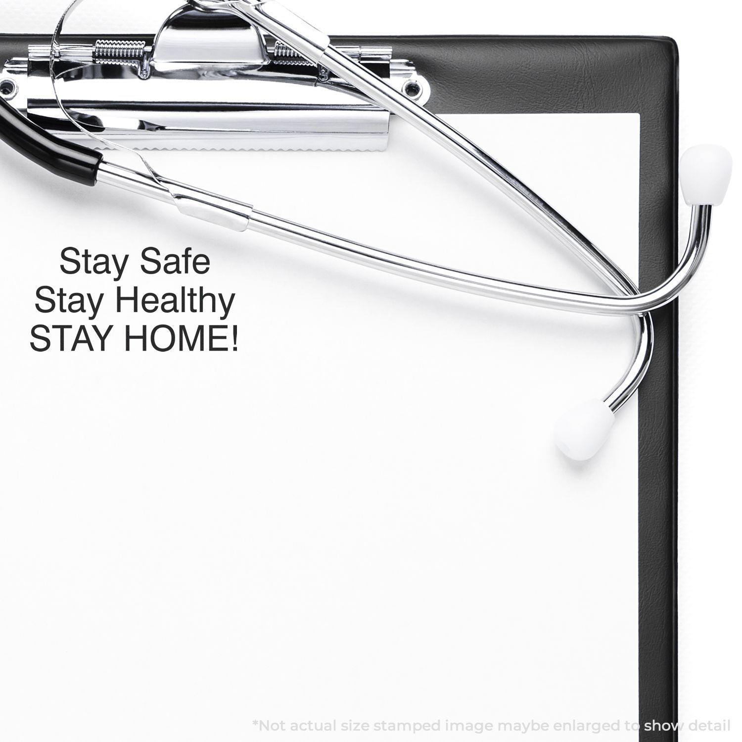 A self-inking stamp with a stamped image showing how the text "Stay Safe Stay Healthy STAY HOME!" is displayed after stamping.