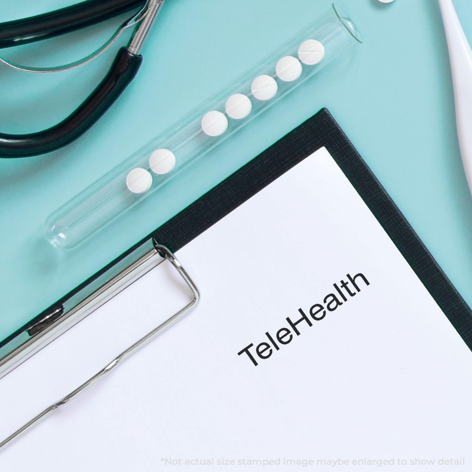 Large TeleHealth rubber stamp on a clipboard with a stethoscope and a test tube with pills on a light blue background.