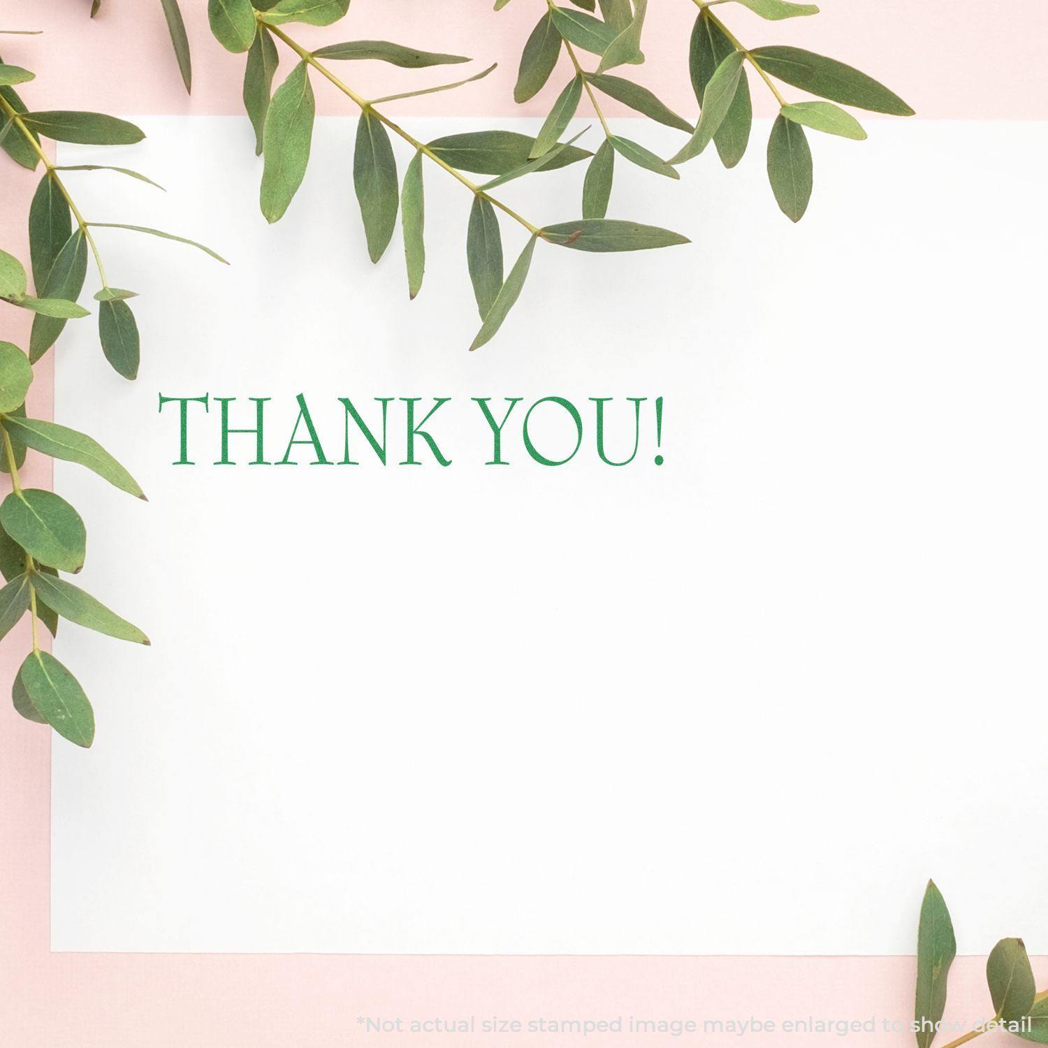 Large Thank You Rubber Stamp on white paper with green leaves around, displaying THANK YOU! in green text.