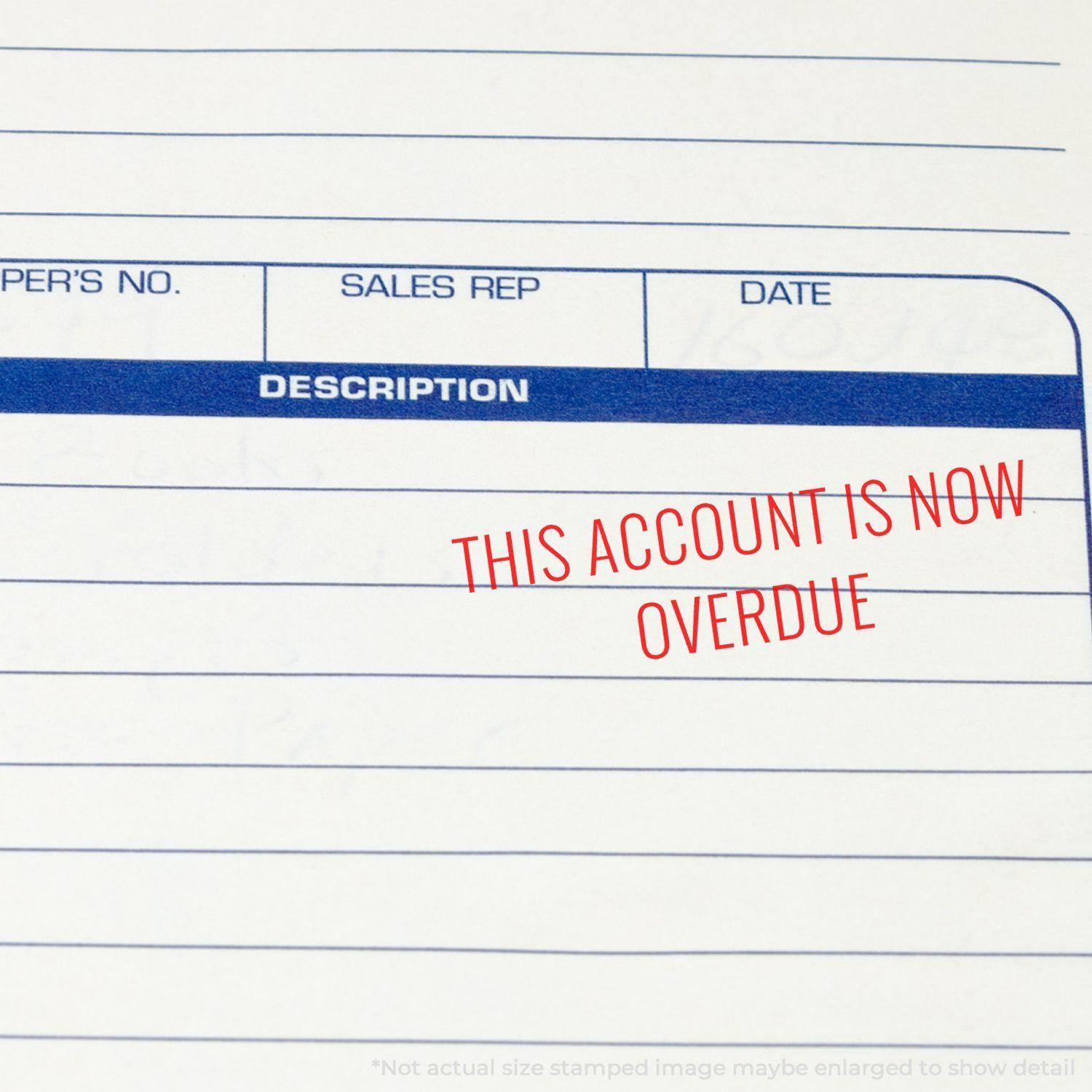 Large This Account Is Now Overdue rubber stamp in red ink on a blank invoice form with columns for description, sales rep, and date.