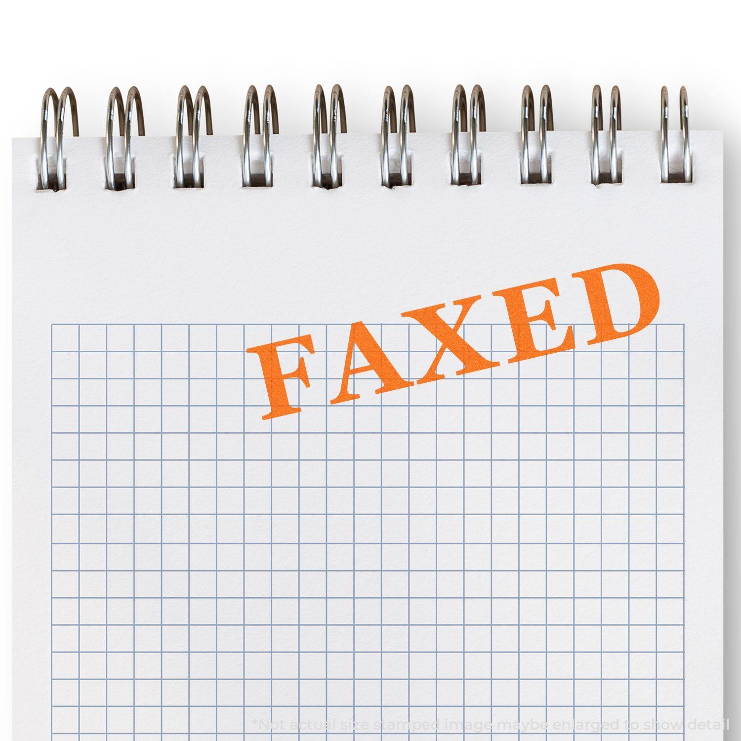 A self-inking stamp with a stamped image showing how the text "FAXED" in a times font is displayed after stamping.