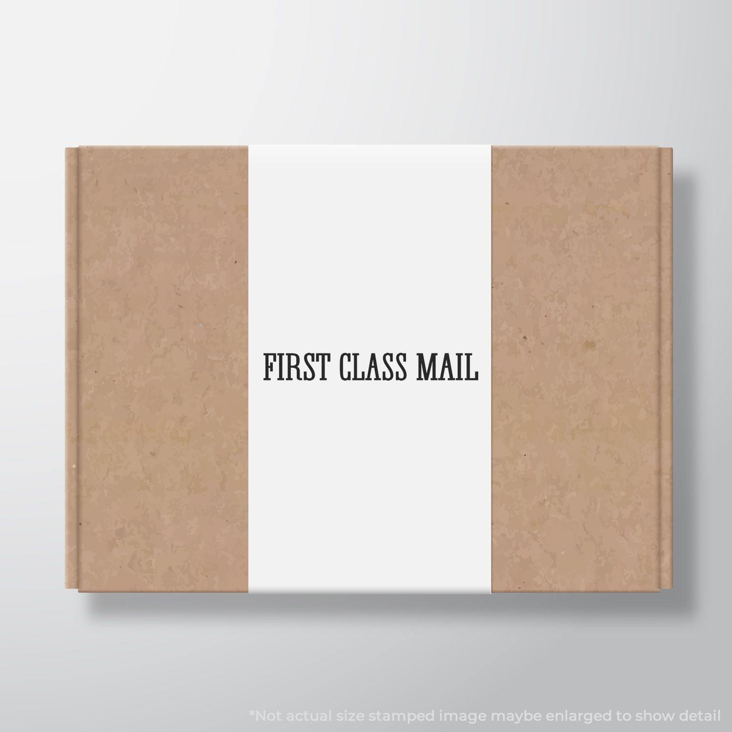 Large Pre-Inked Times First Class Mail Stamp used on a brown package, displaying FIRST CLASS MAIL in black text on a white label.