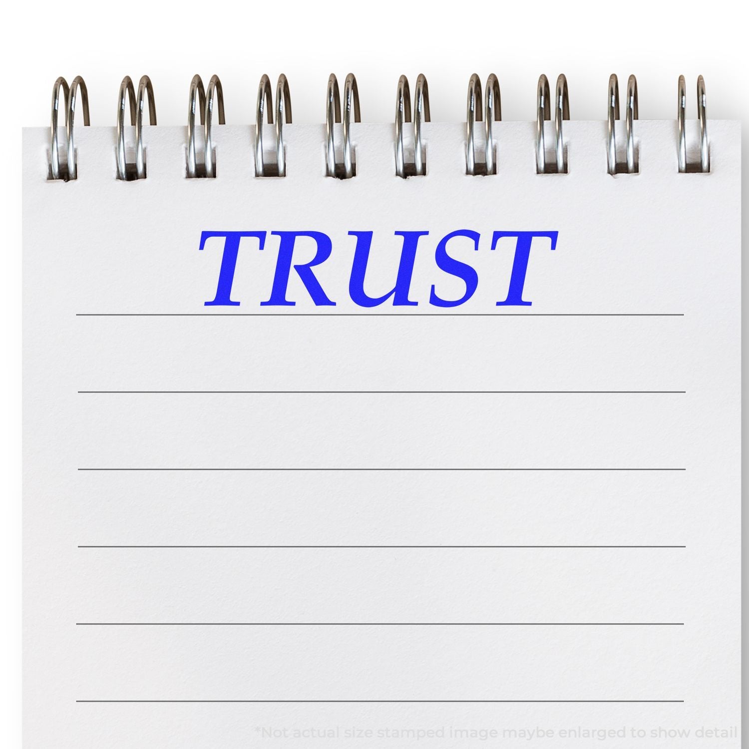 A notebook page stamped with the word TRUST in blue ink using the Large Self Inking Trust Stamp.