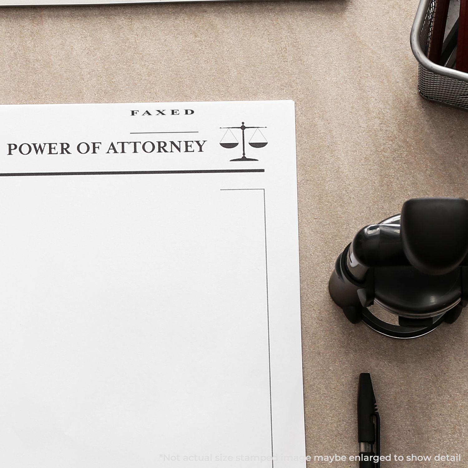 Large Two Line Faxed Rubber Stamp on a Power of Attorney document, with a pen and office supplies on a desk.