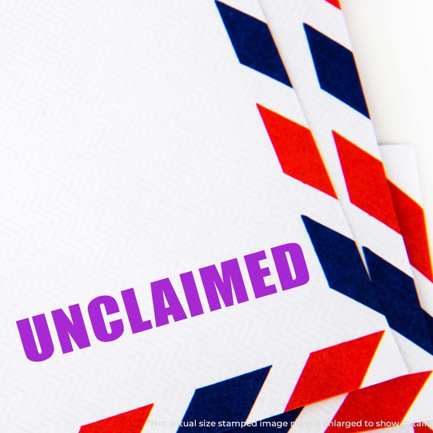 Envelope with red and blue border stamped with 'Unclaimed' in purple ink, indicating the item has not been claimed.