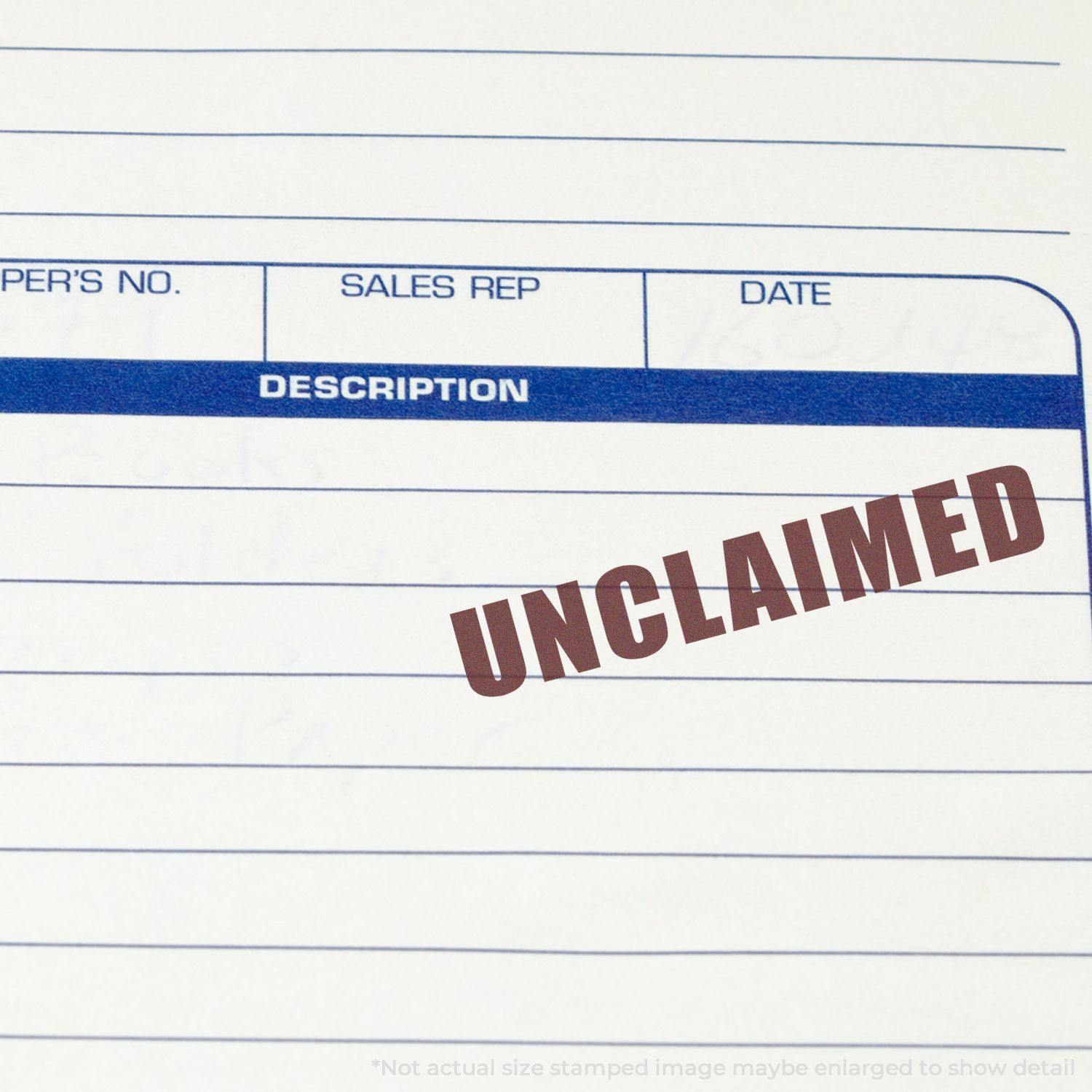 Self Inking Unclaimed Stamp in red ink on a document with columns for description, sales rep, and date.