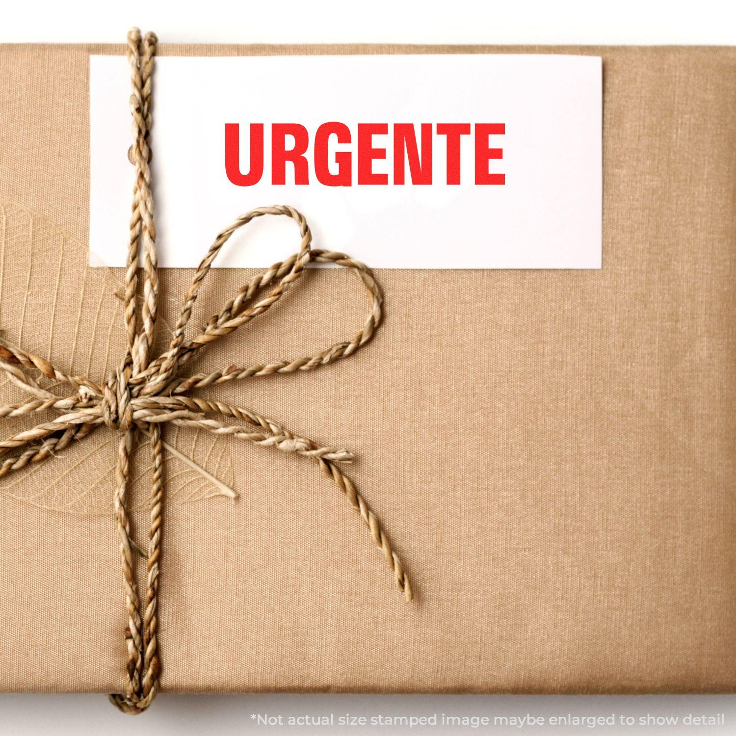 A stock office rubber stamp with a stamped image showing how the text "URGENTE" in a large font is displayed after stamping.