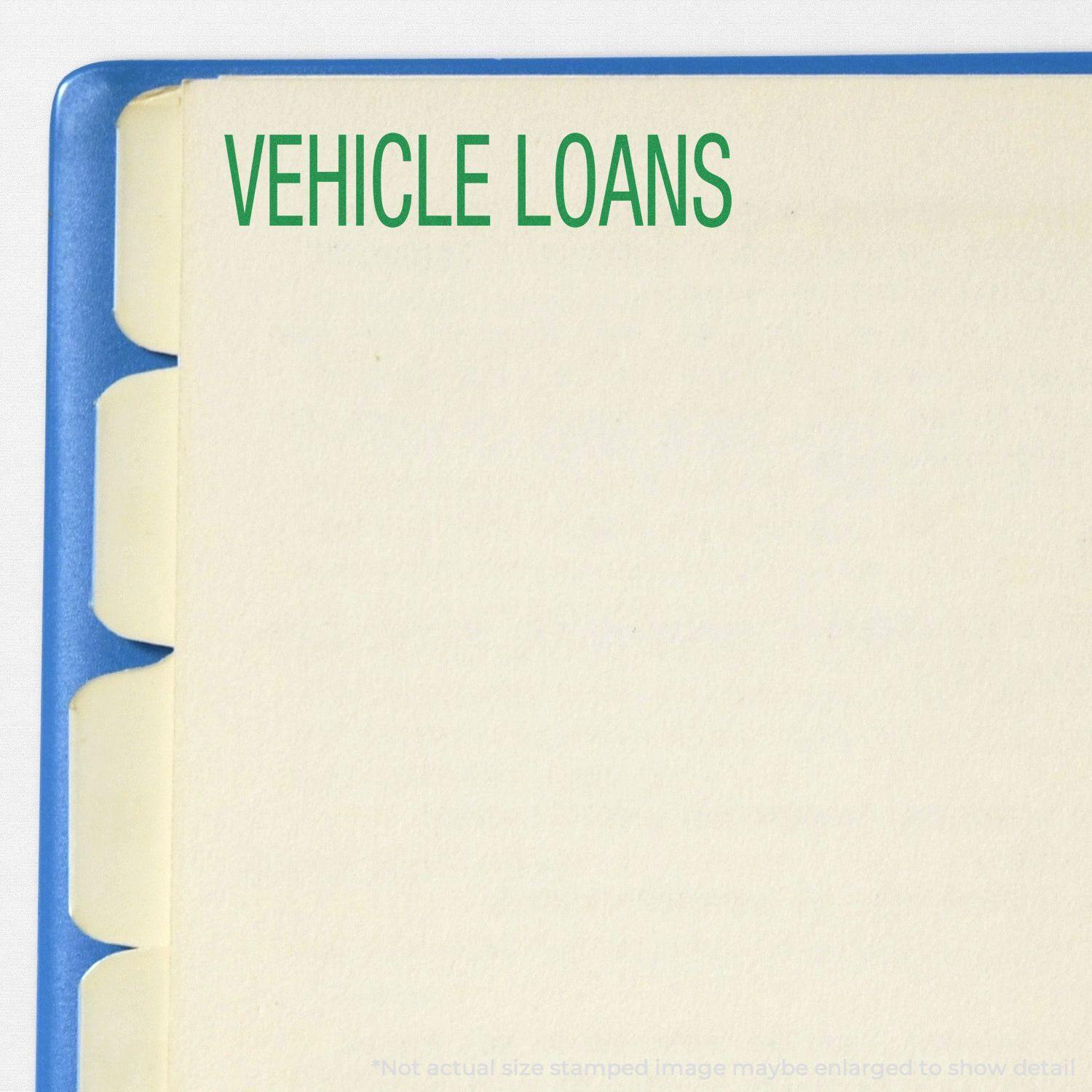 Large Self Inking Vehicle Loans Stamp used on a file folder with the text VEHICLE LOANS in green at the top left corner.