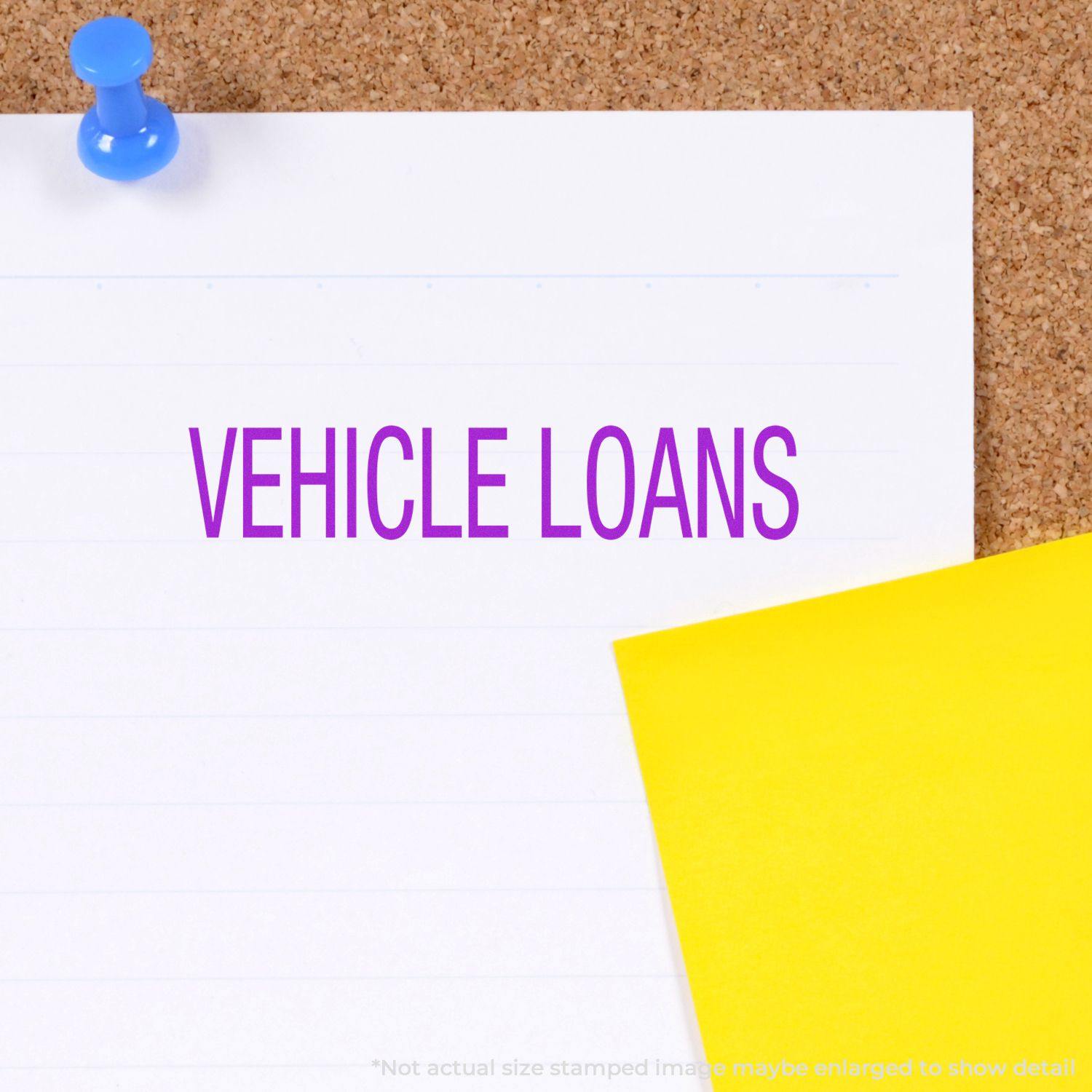 Large Vehicle Loans Rubber Stamp on white paper pinned to a corkboard with a yellow sticky note beside it.