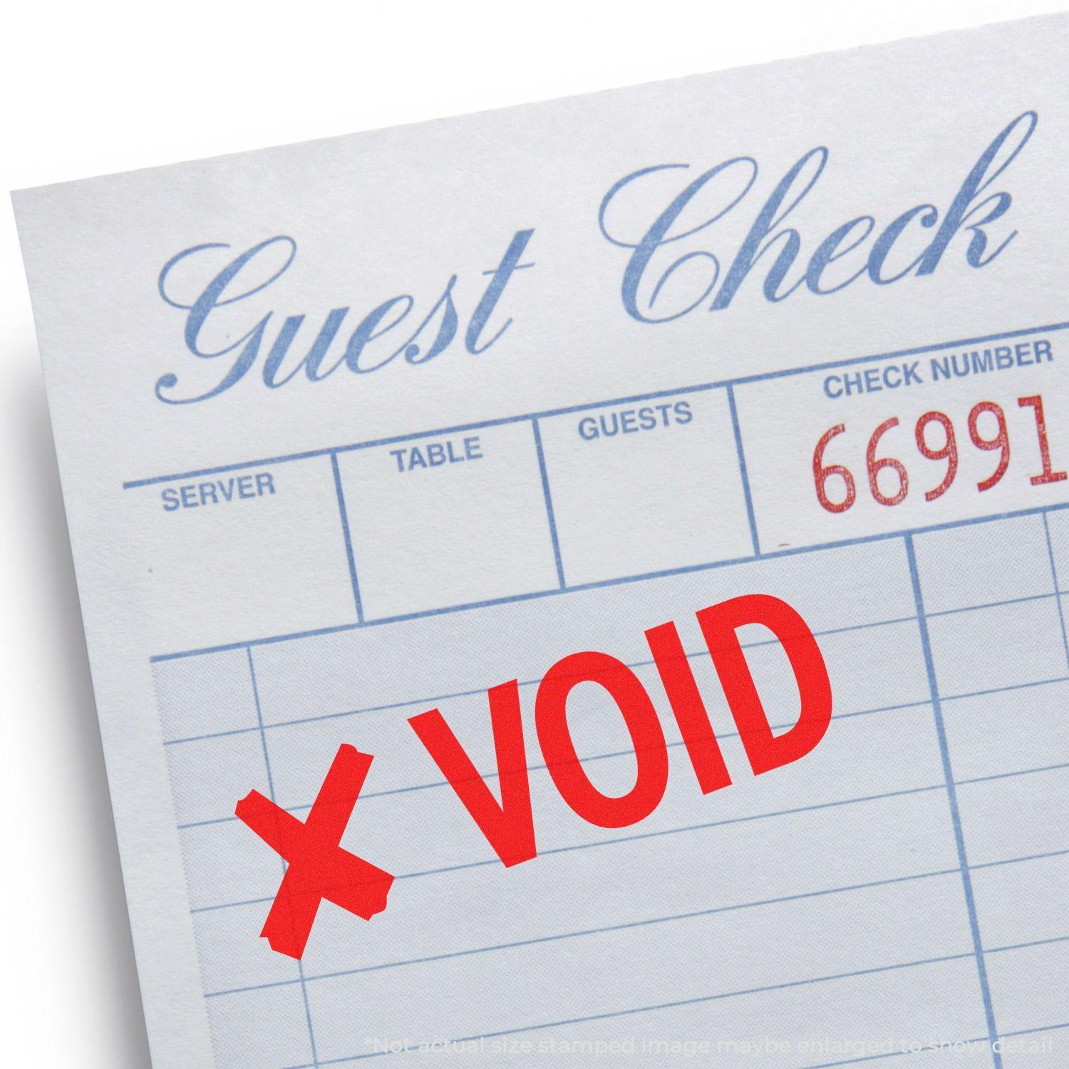 Guest check with a large VOID stamped in red ink, featuring an X rubber stamp, indicating the document is invalid.