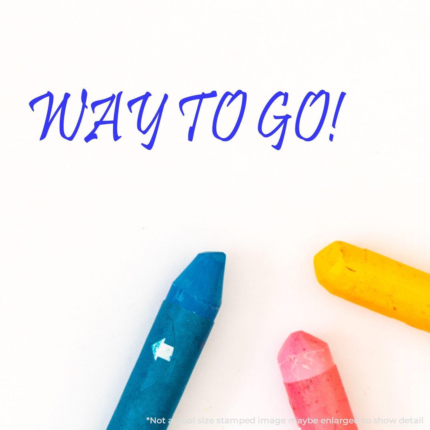 Large Pre-Inked Way To Go Stamp in blue ink on white paper, with colorful crayons nearby. Text reads 'WAY TO GO!'