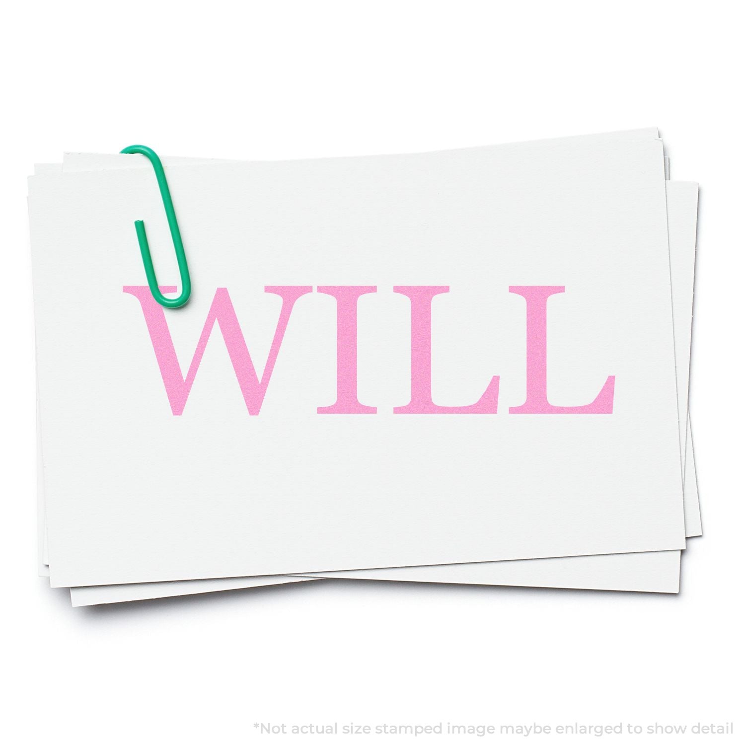 Self Inking Will Stamp imprinting the word WILL in pink on white paper, secured with a green paperclip.